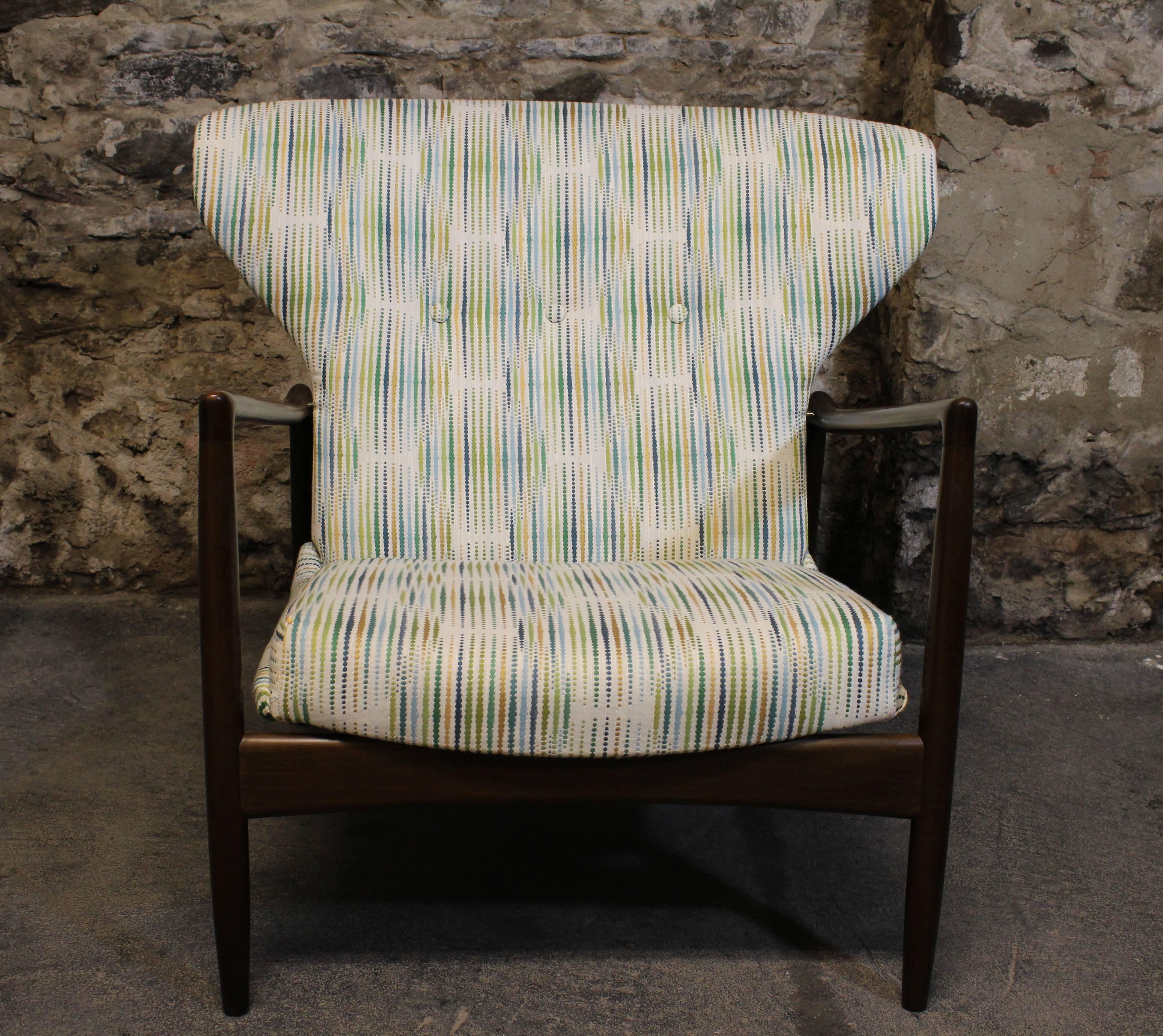 Style meets function with this Classic midcentury design by IB Kofod-Larsen. Reupholstered in a fun fabric this timeless lounge chair will look good where ever it is placed in a room.

Scandinavian Modern / Mid-Century Modern.