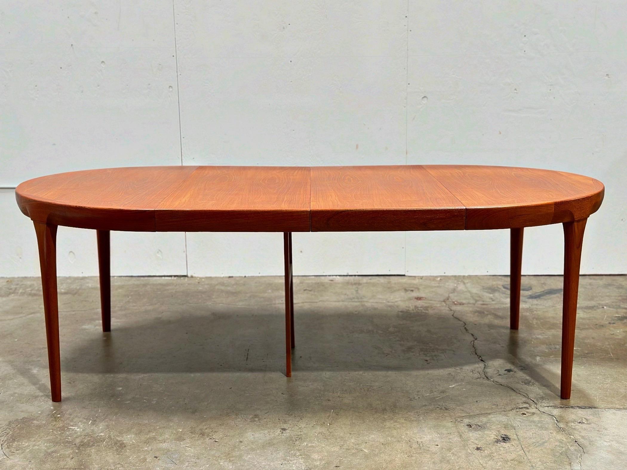 Ib Kofod Larsen Midcentury Teak Dining Table for Faarup - Round to Oval In Good Condition In Decatur, GA