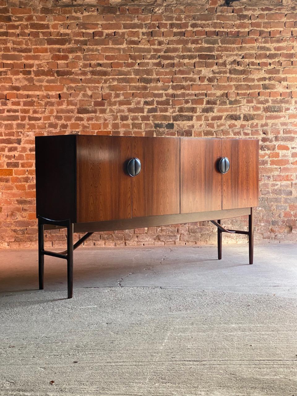 Ib Kofod Larsen Model 4060 Rio rosewood sideboard, Circa 1964

Magnificent mid century Danish design Ib Kofod Larsen Model 4060 Rio rosewood sideboard circa 1964, manufactured by G Plan E Gomme Limited, The 'Danish Range' was aimed at the top end