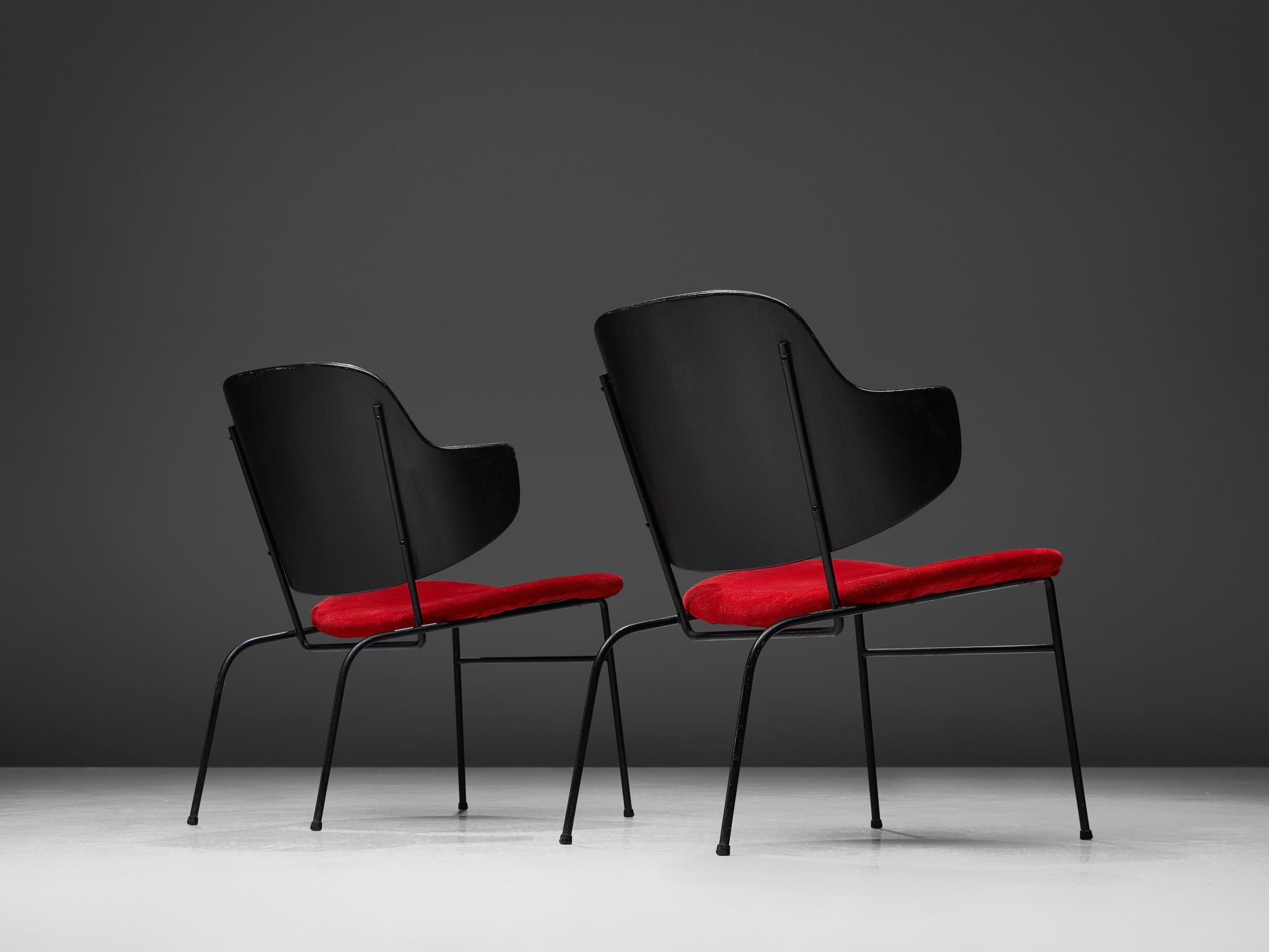 Ib Kofod-Larsen, set of 2 'Penguin' lounge chairs, wood, steel, metal and red fabric upholstery, Denmark, design 1953, production 1960s.

The 'Penguin' slipper chair was first taken into production by Selig in 1953. The chairs are always built up