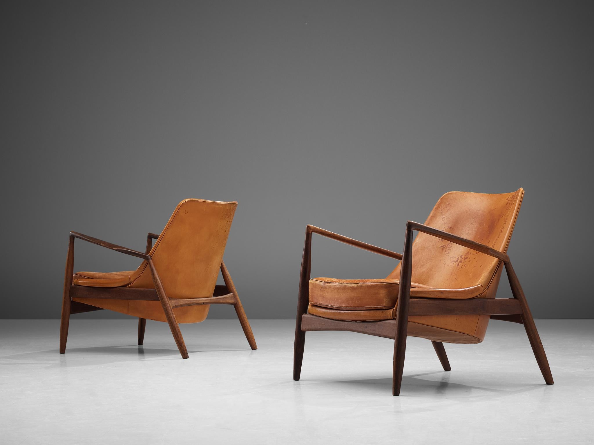 Ib Kofod-Larsen for OPE Mobler, restored pair of 'Sälen' (Seal) lounge chairs model 503-799, teak and leather, Sweden, 1956

Iconic 'Sälen' (seal) lounge chairs by Danish designer Ib Kofod-Larsen. The well-crafted frame of these chairs is made out