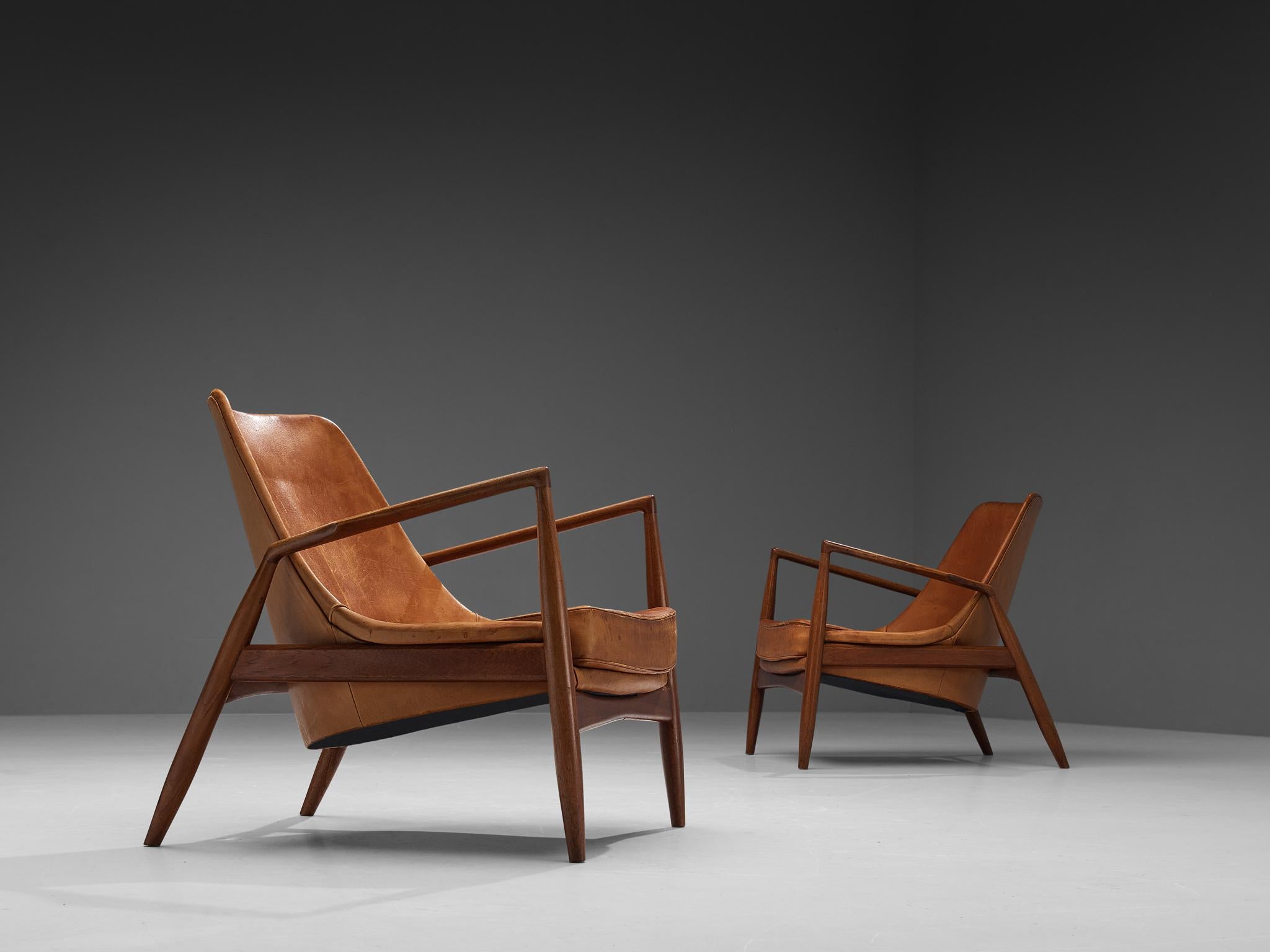 Ib Kofod-Larsen for OPE Möbler, pair of 'Sälen' (Seal) lounge chairs model 503-799, teak and leather, Sweden, 1956

Iconic 'Sälen' lounge chairs by Danish designer Ib Kofod-Larsen. The well-crafted frame of these chairs is made out of a warm colored