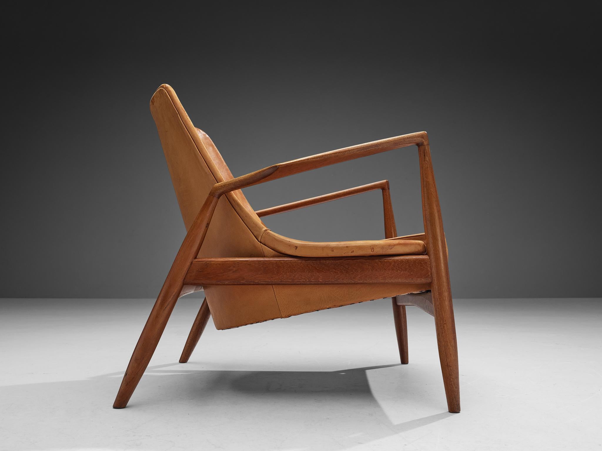 Scandinavian Modern Ib Kofod-Larsen Pair of ‘Seal’ Lounge Chairs in Cognac Leather and Teak
