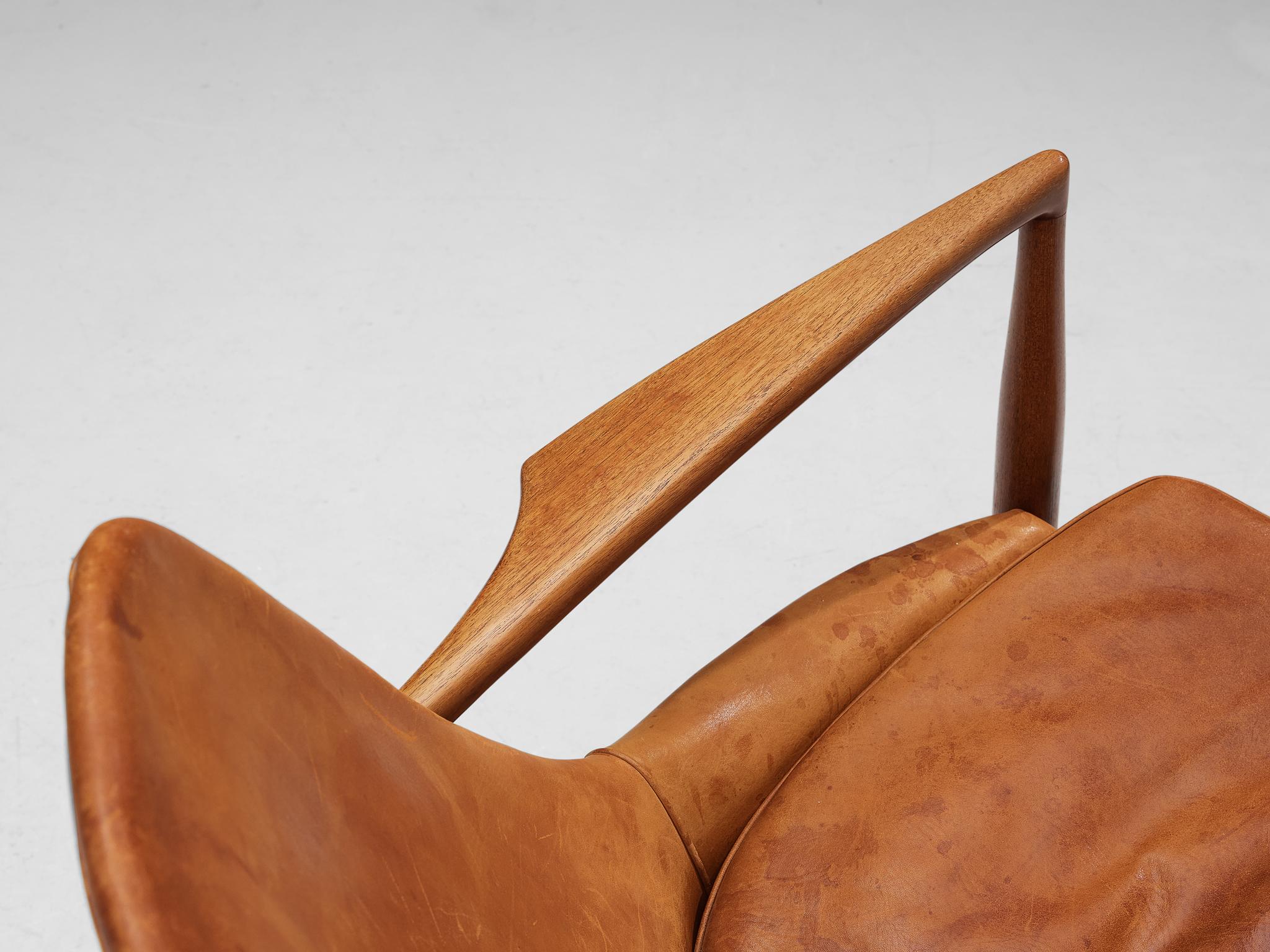 Mid-20th Century Ib Kofod-Larsen Pair of ‘Seal’ Lounge Chairs in Cognac Leather and Teak