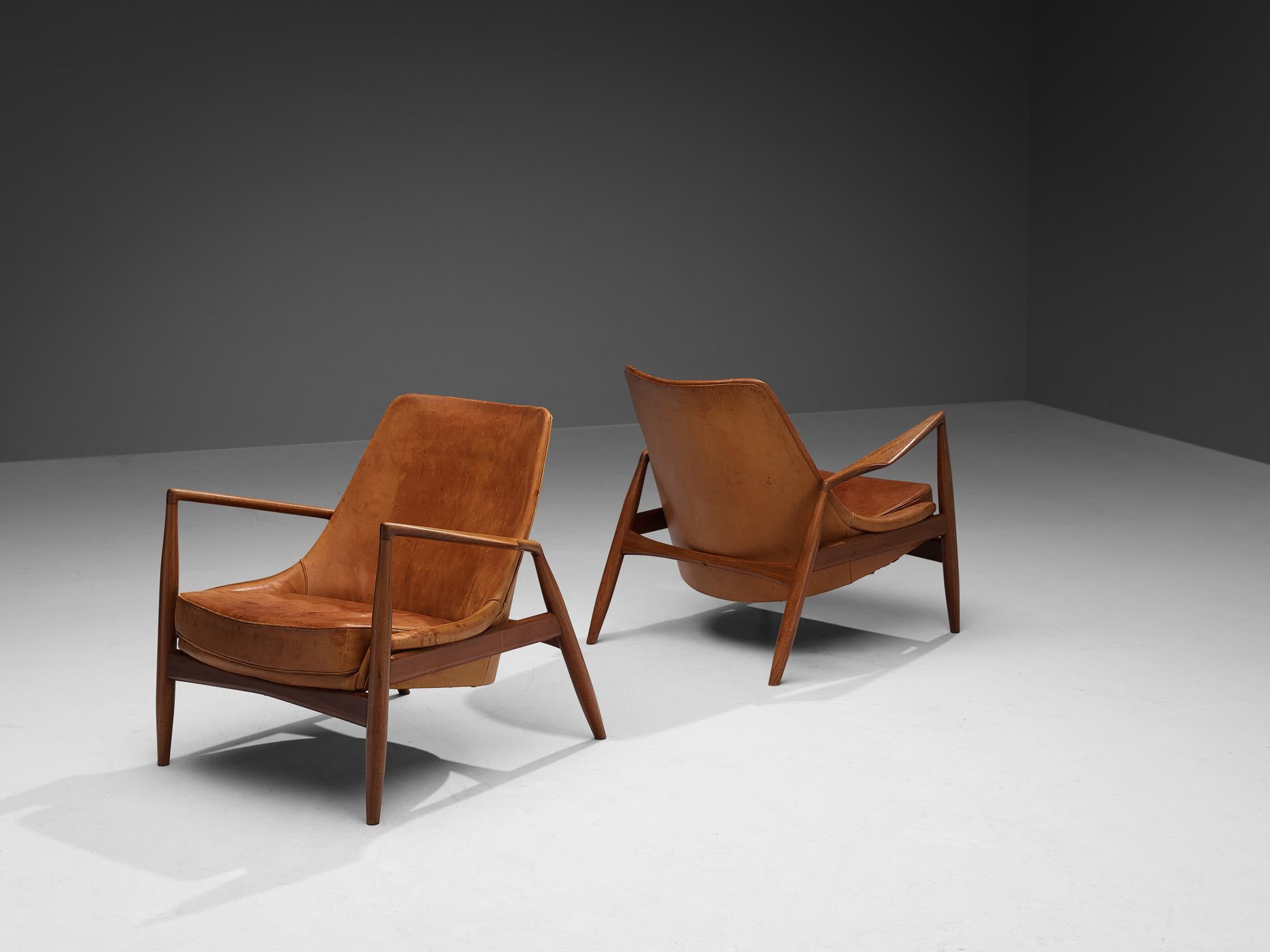 Ib Kofod-Larsen Pair of ‘Seal’ Lounge Chairs in Cognac Leather and Teak 1