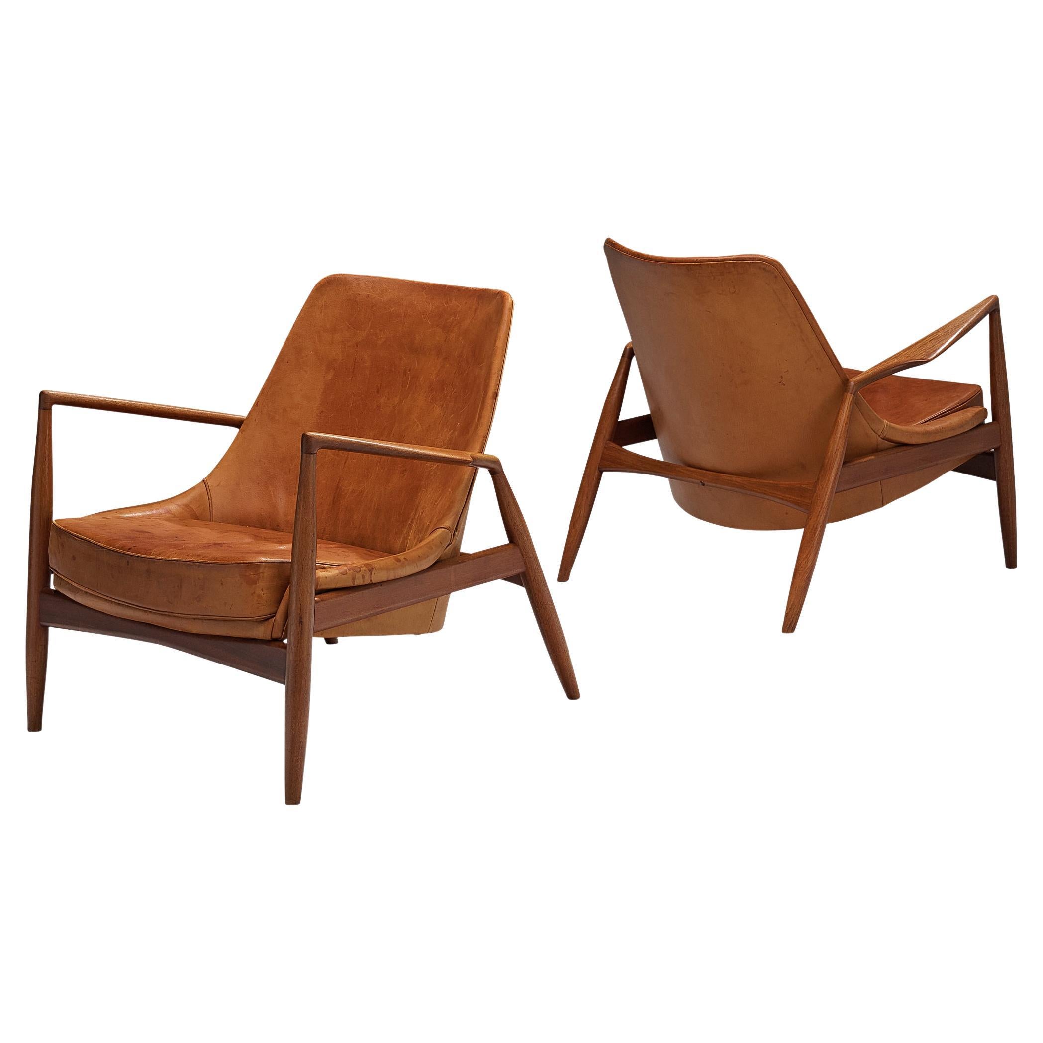 Ib Kofod-Larsen Pair of ‘Seal’ Lounge Chairs in Cognac Leather and Teak
