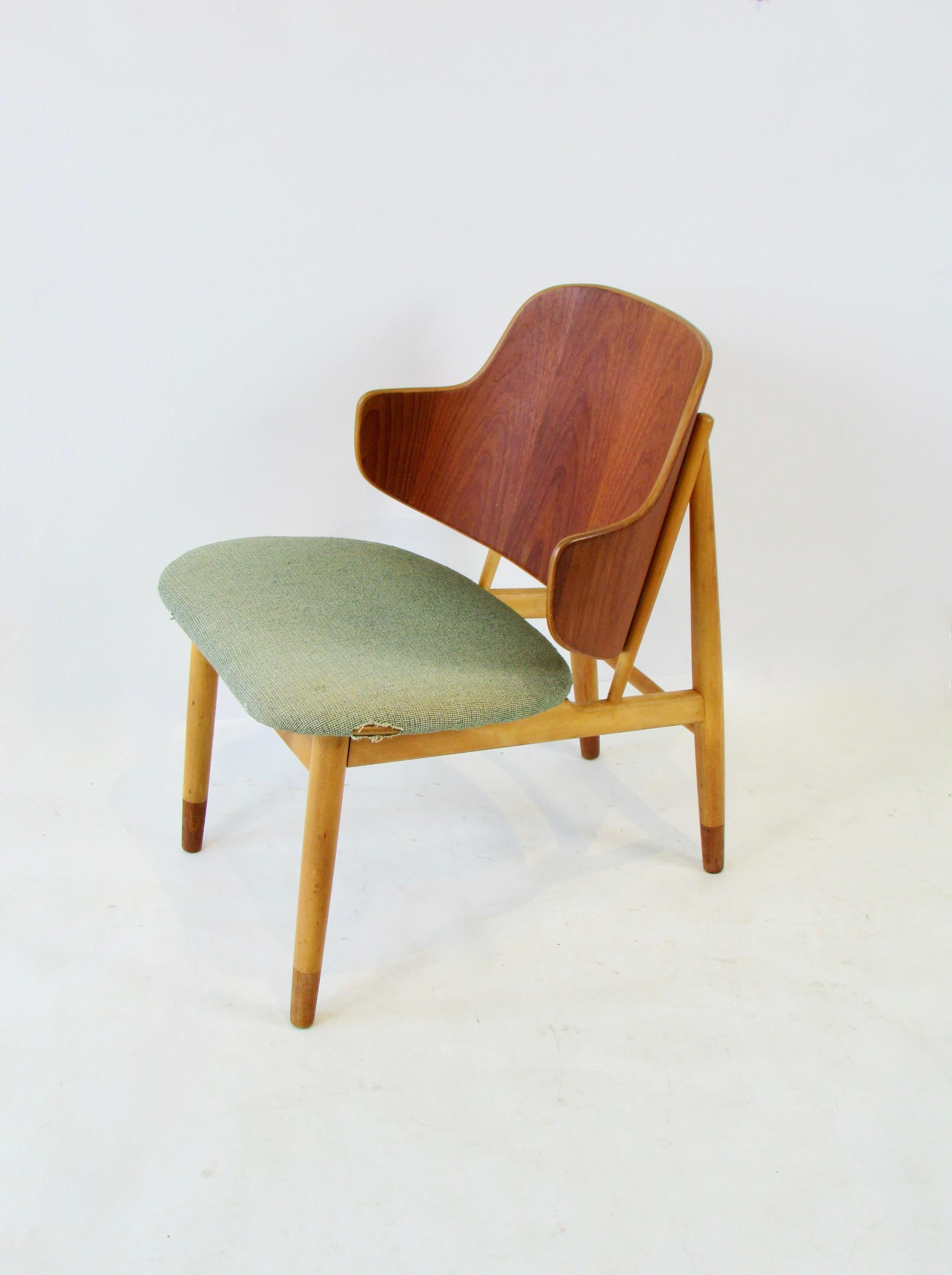 
Ib Kofod-Larsen design Chair produced by Christiansen & Larsen . Designed in the early 1950s by Kofod Larsen and manufactured by Christensen & Larsen A/S in Denmark. A classic  clean and  refined example of the Danish Modern design. Natural teak