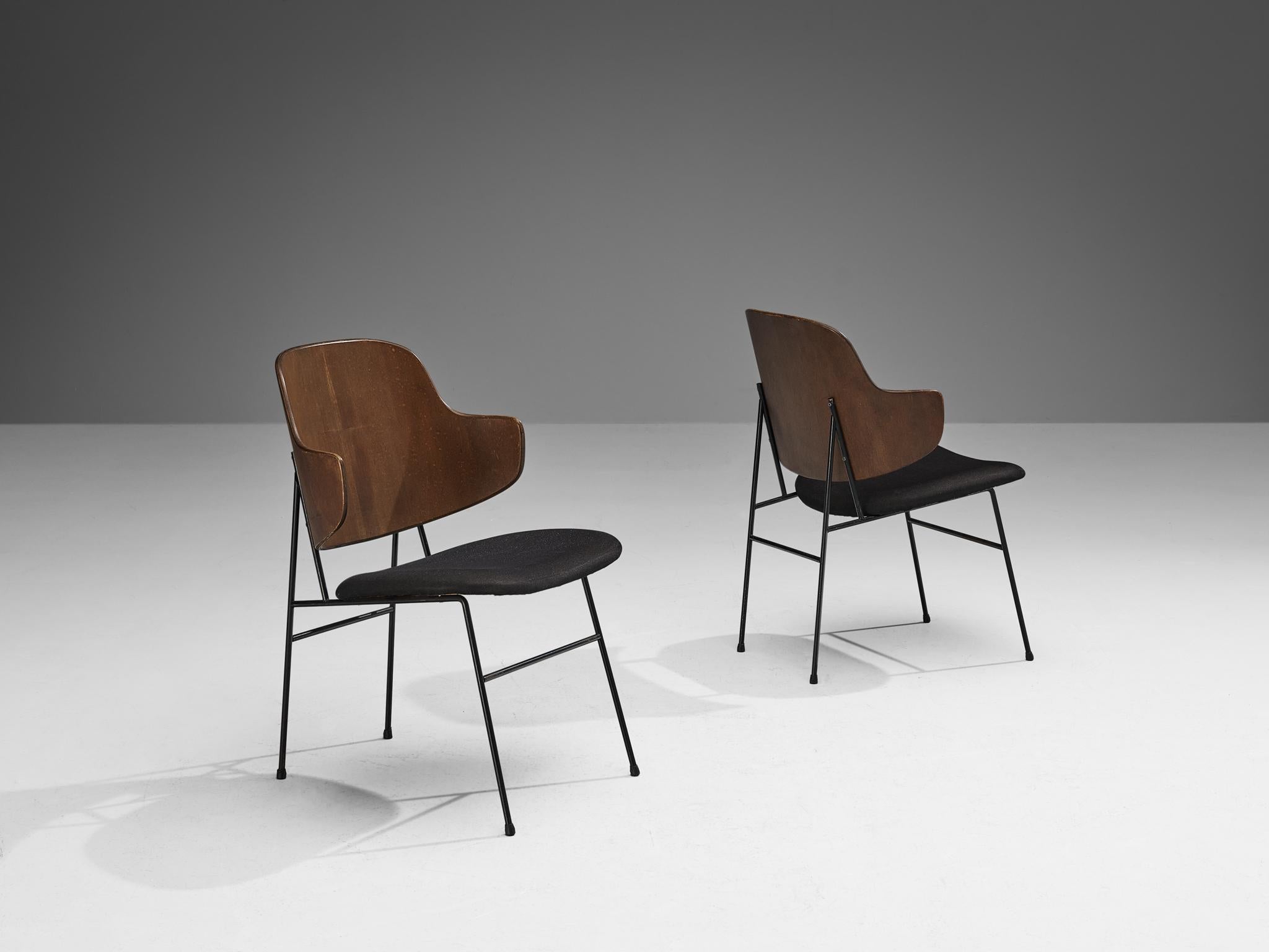 Ib Kofod-Larsen for Christensen & Larsen, 'Pinguin' dining chairs, mahogany plywood, fabric, coated iron, Denmark, design 1953, production, 1960s.

The 'Pinguin' chair by Ib Kofod-Larsen was first taken into production by Selig in 1953. The chairs