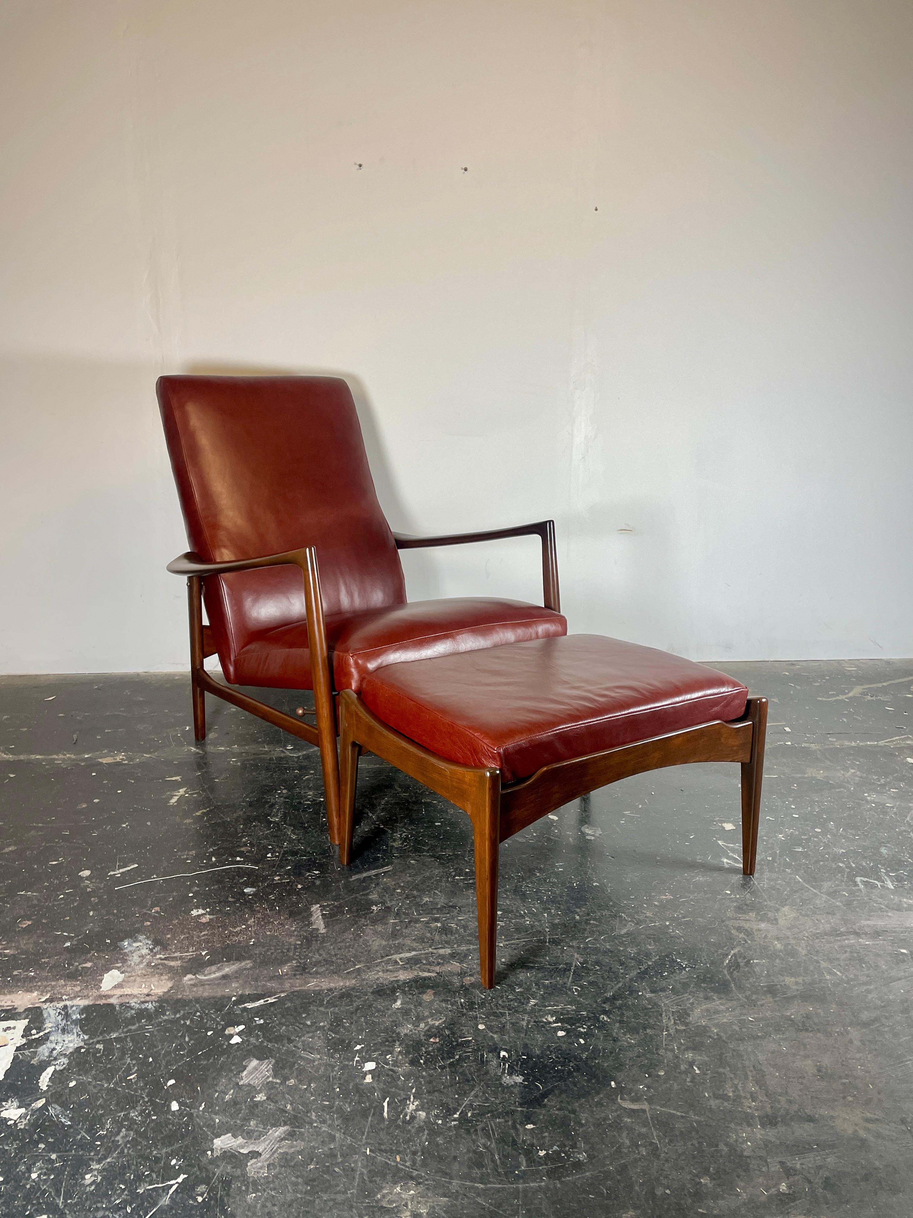 IB Kofod-Larsen Recliner and Ottoman for Selig in soft oxblood Italian leather. This recliner is unusual for the period because it has a high back, which is a  great chair for tall people. Completely upholstered on the back too. This chair and