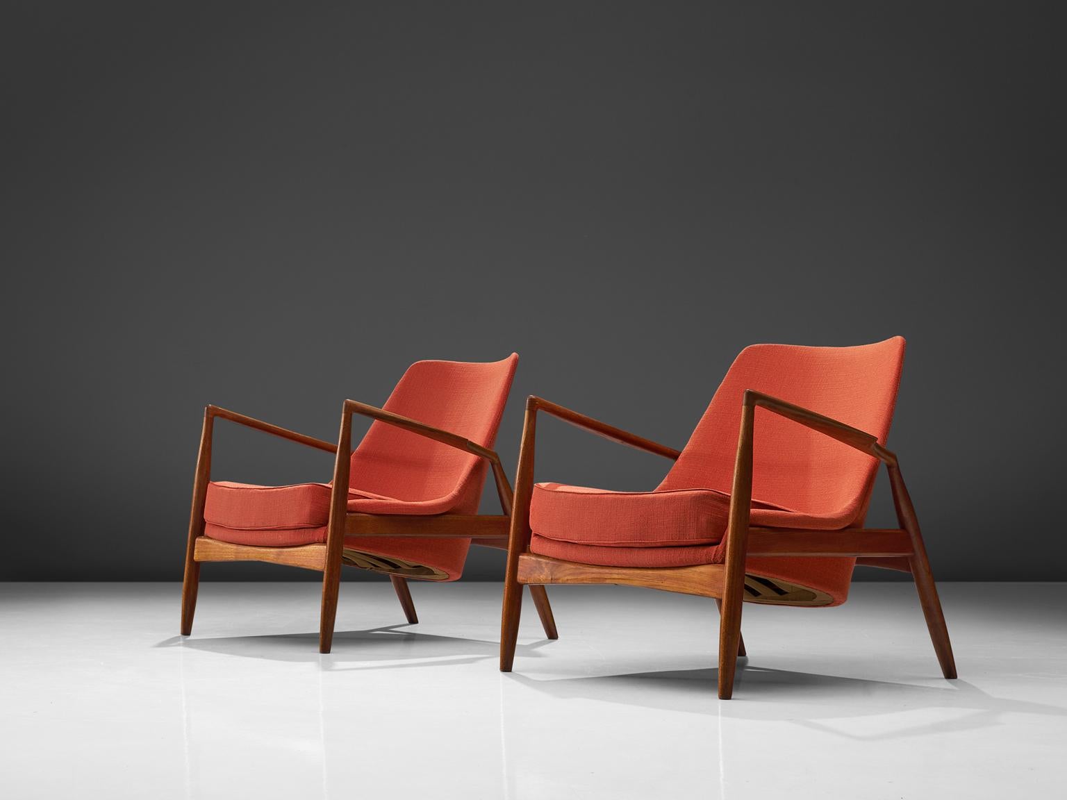 Ib Kofod-Larsen for OPE, set of two 'Sälen' (Seal) lounge chairs model 503-799, teak and red fabric, Sweden, 1956. 

This is a set of the iconic seal lounge chair. The well-crafted frame of this chair is made of a ruby colored teak. It shows very