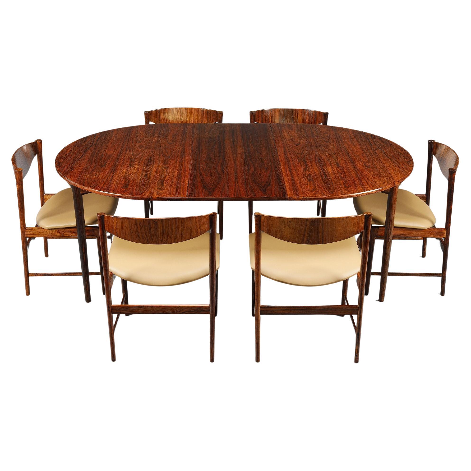 Ib Kofod-Larsen rosewood dining table with extension leaf and six chairs