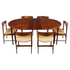 Ib Kofod-Larsen rosewood dining table with extension leaf and six chairs