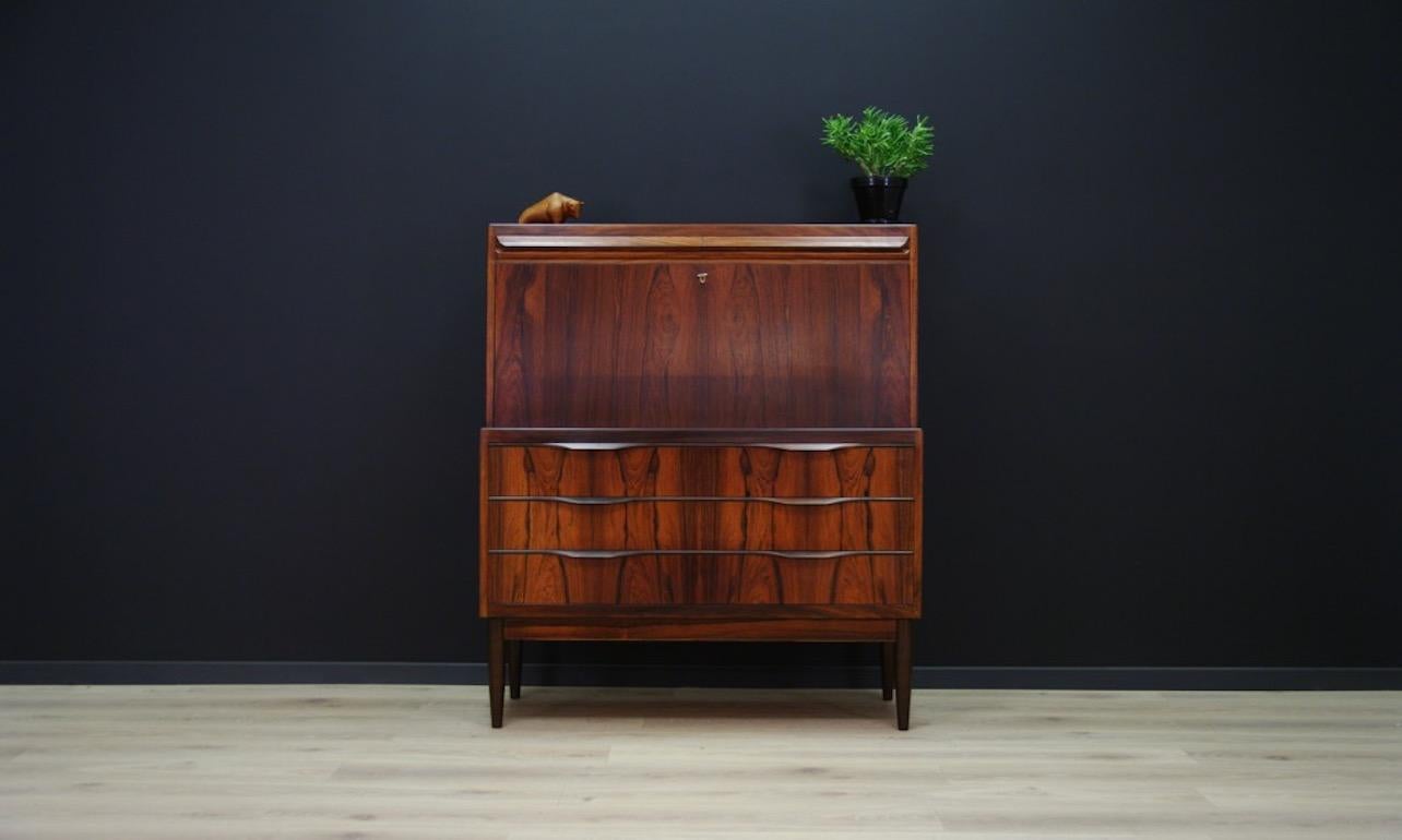 Fantastic bureau from the 1960s-1970s, Scandinavian design by Ib Kofod Larsen. A brilliant form finished with rosewood veneer. The secretary has a large writing desk and numerous drawers. Preserved in good condition (small dings and scratches),