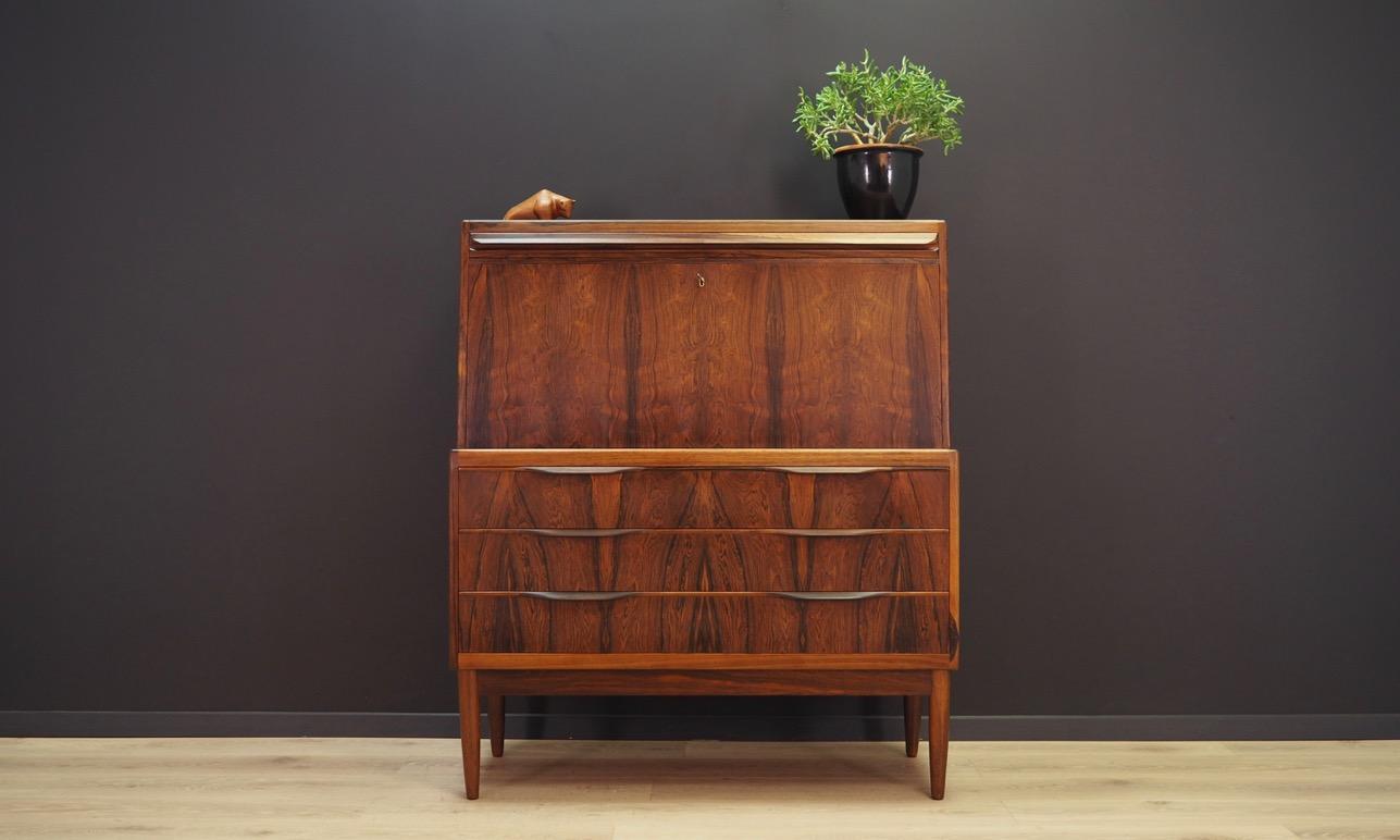 Fantastic secretary from the 1960s-1970s, Scandinavian design by Ib Kofod-Larsen. Excellent form finished with rosewood veneer. Secretary has a large writing desk and numerous drawers. Maintained in good condition (minor bruises and scratches) -