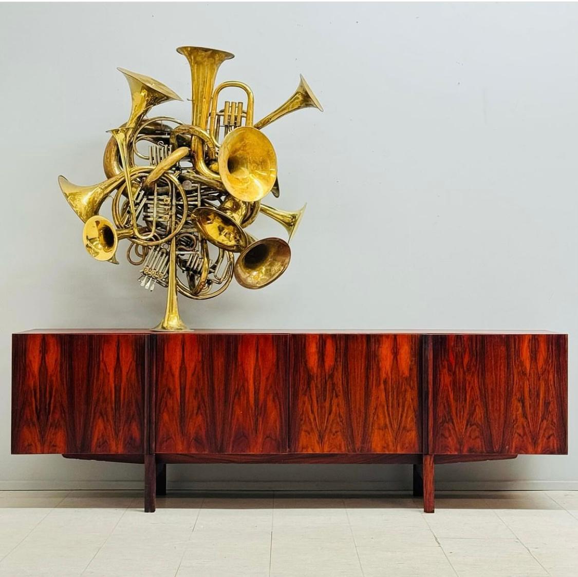 Stunning Rosewood credenza designed by IB Kofod-Larsen for Faarup Mobelfabrik. Very Rare model. Circa 1960’s. Retains original finish and patina, The book-match rosewood graining is amazing. Hand delivery avail to New York City or anywhere en route