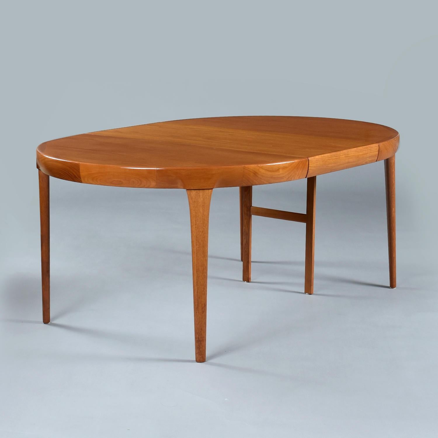 Mid Century Modern Danish teak dining table by Ib Kofod Larsen for Faarup Møbelfabrik. One of the finest Scandinavian producers of the era. This dynamic table offers three size options. Short on space? Use the table at its most compact size, a 47″