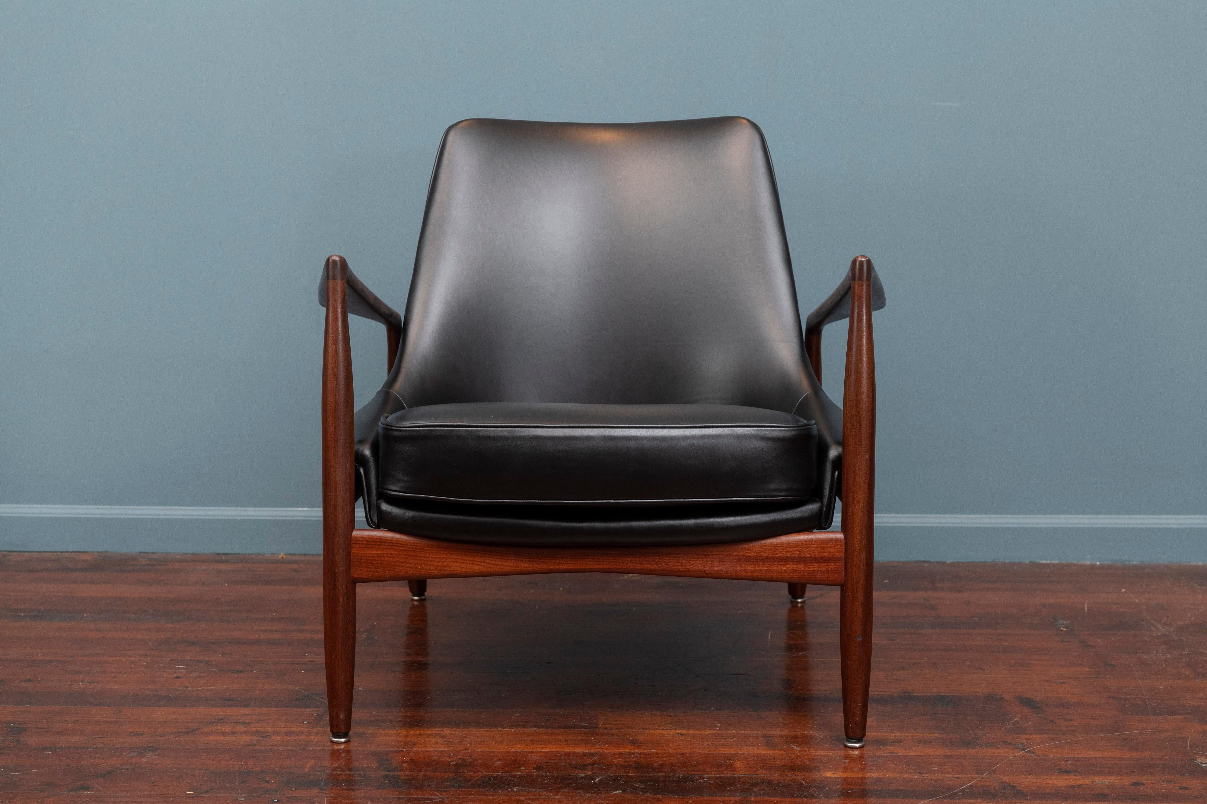 Ib Kofod-Larsen design seal chair for OPE, Denmark. Excellent original finish teak frame newly upholstered in Italian black leather, ready to enjoy.
