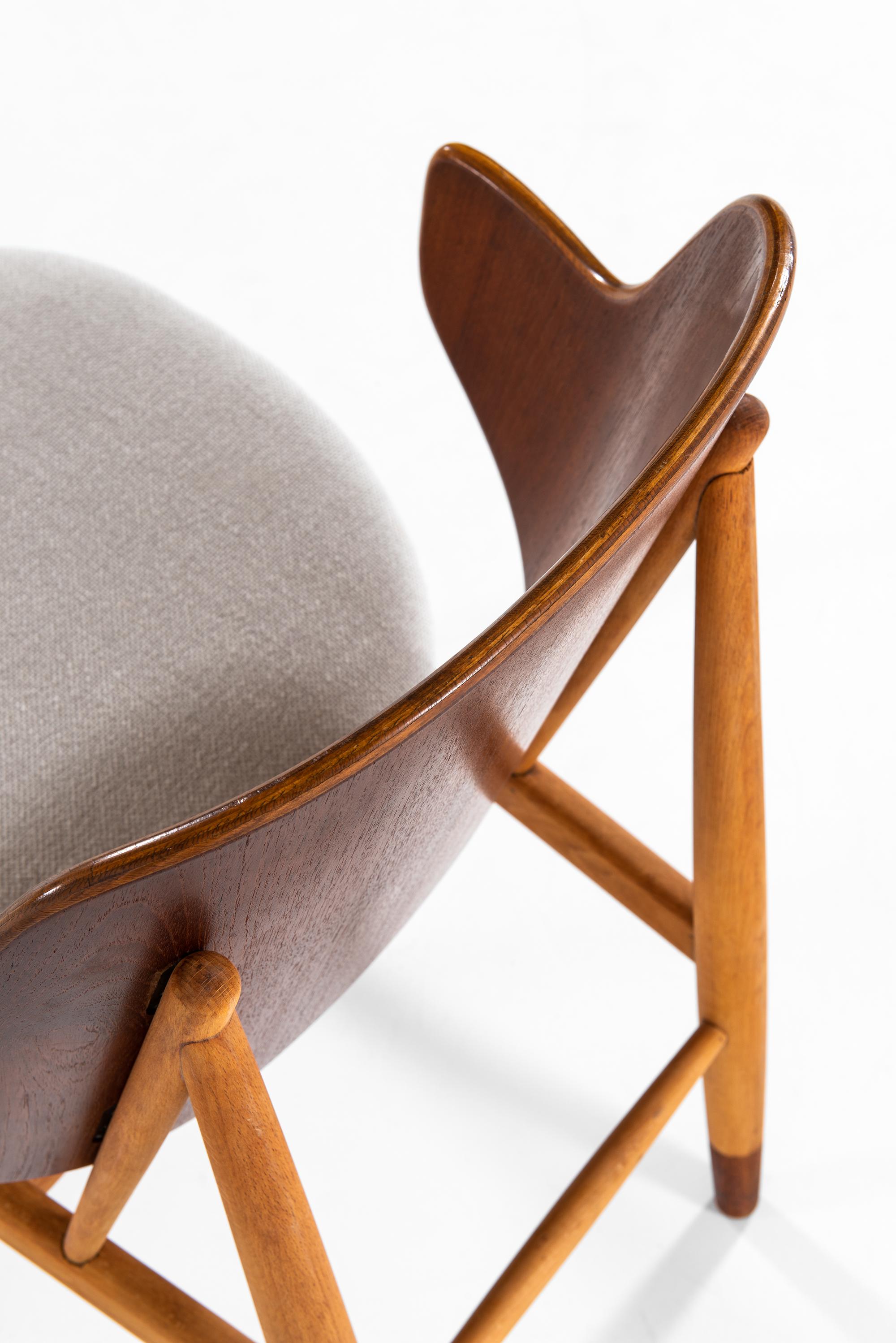 Rare shell easy chair designed by Ib Kofod-Larsen. Produced by Christensen & Larsen in Denmark.