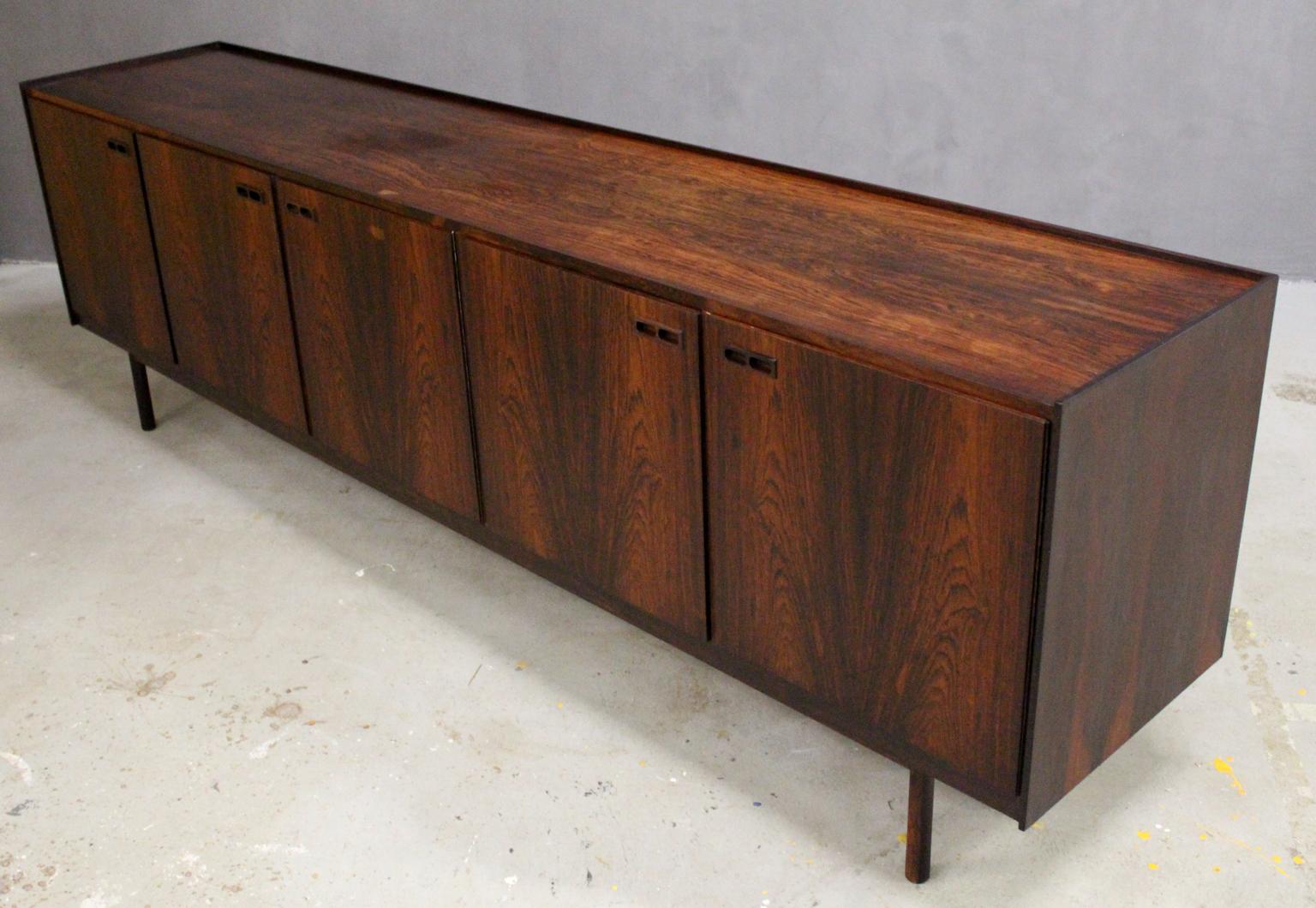 Ib Kofod Larsen sideboard with fine details both on the outside as well on the inside. Veneered with rosewood.

Made by Brande Møbelfabrik, 1960s.