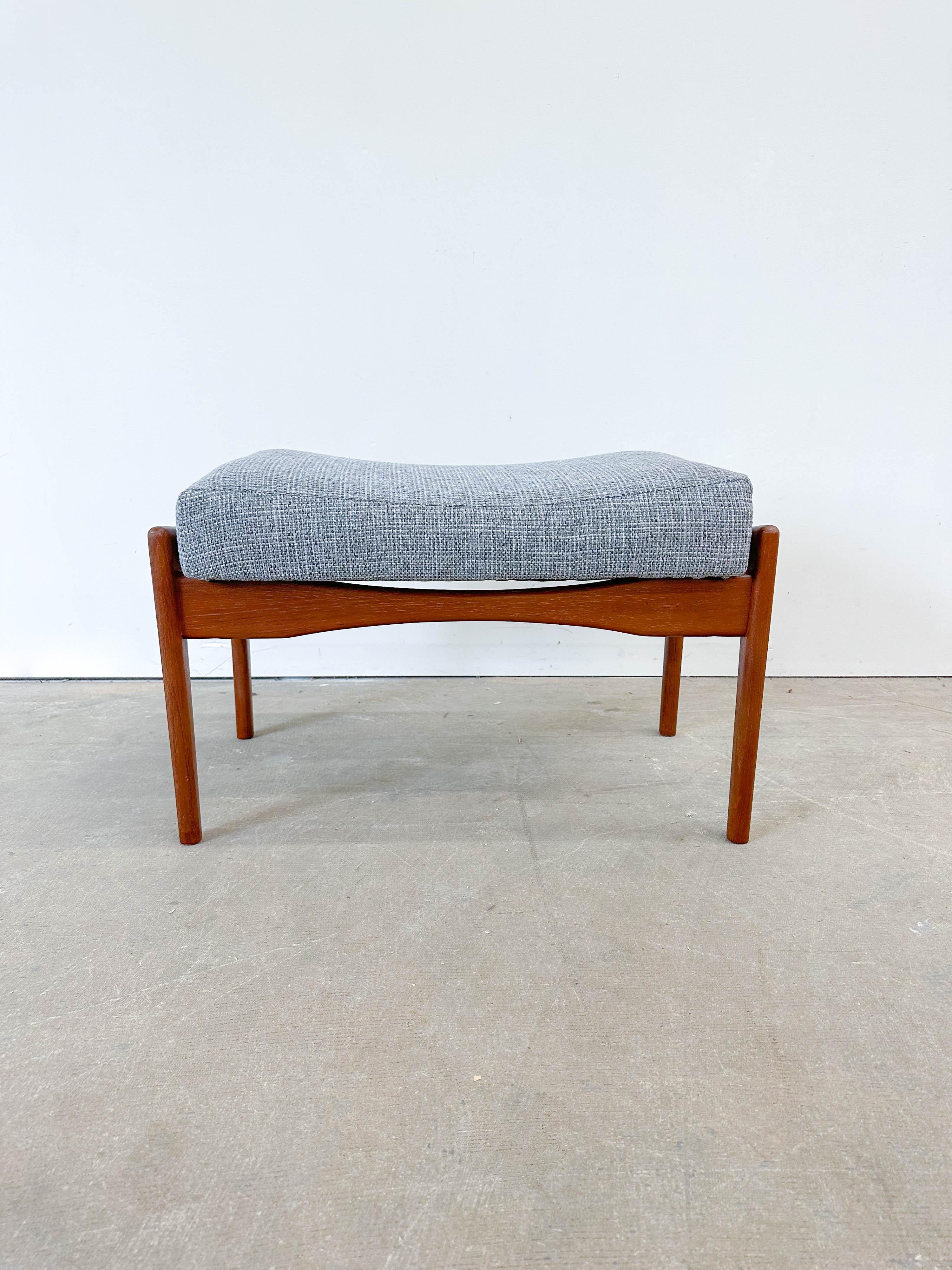 Large ottoman or stool designed by In Kofod Larsen for OPE of Sweden in the 1960s. Solid teak frame with newly reupholstered seat cushion. Nicely tapered stretchers give the cushion the illusion of floating.
