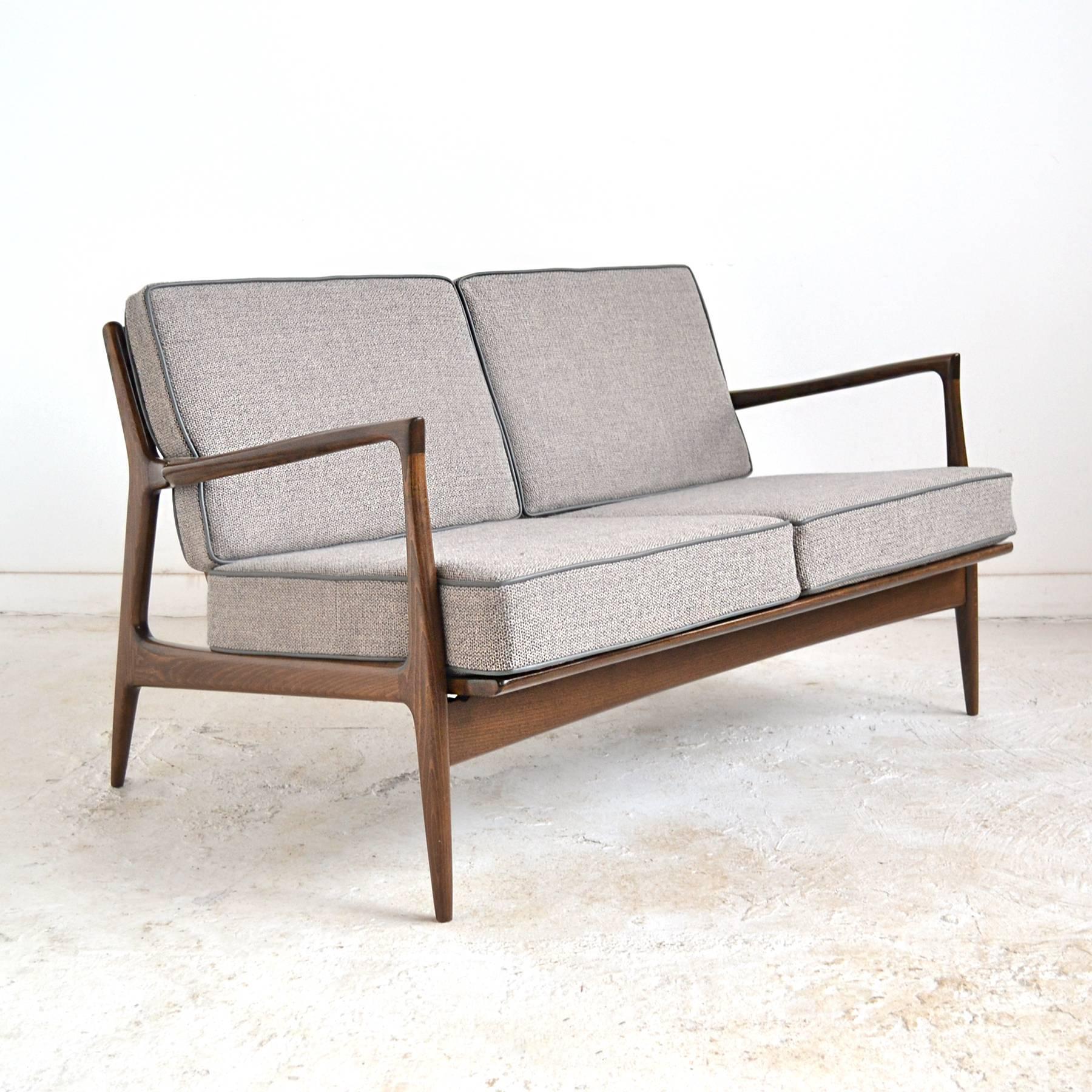 This two-seat sofa by Kofod-Larsen for Selig reflects the how significant the impact and popularity of Scandinavian design was in midcentury America. The subtle, elegant lines, light scale and fine craftsmanship appealed to the public and fit the