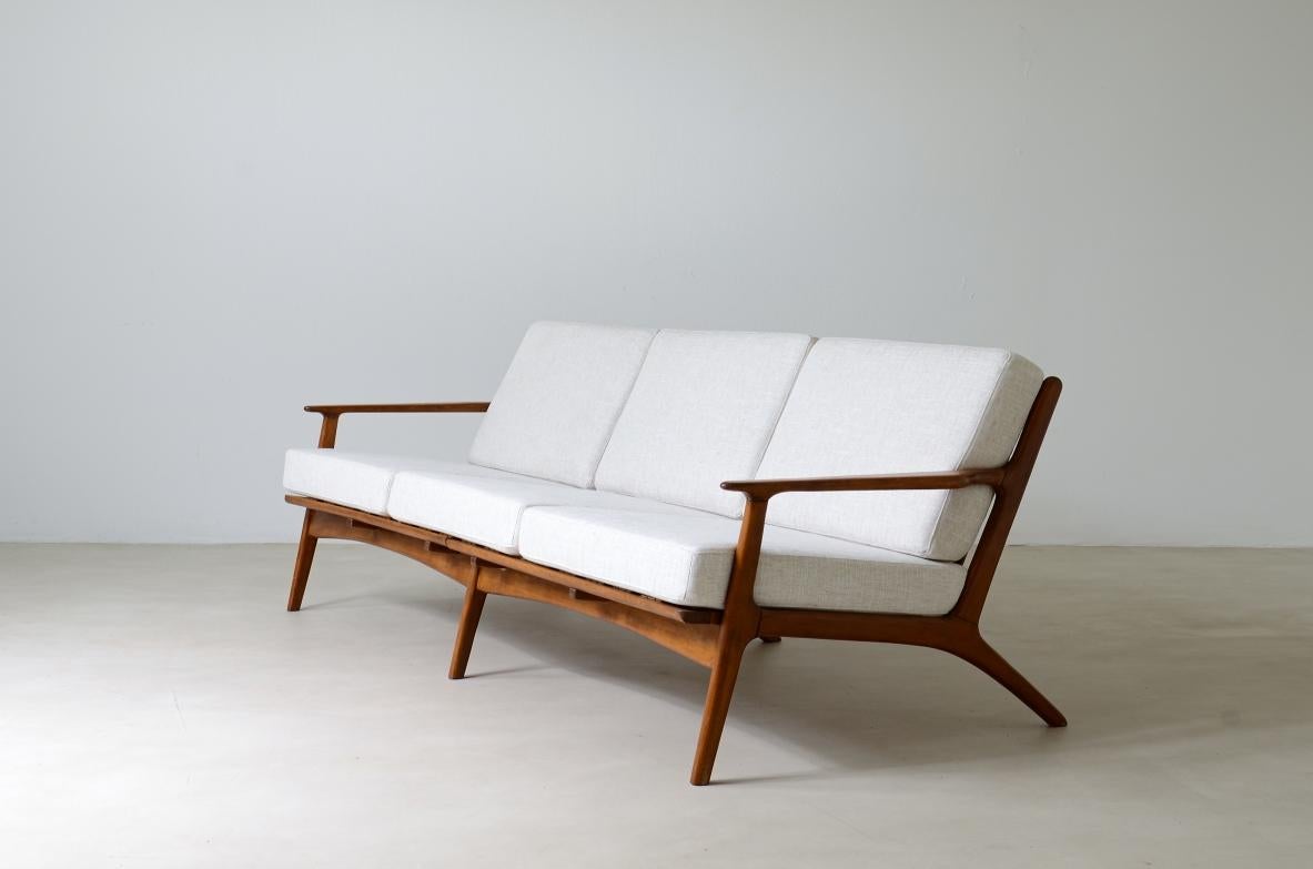 Ib Kofod Larsen

Sofa in teak with seat and back in upholstered fabric.

The sofa is part of a first production which was interrupted shortly afterwards and was therefore produced in very small numbers.

Scandinavian manufacture, early