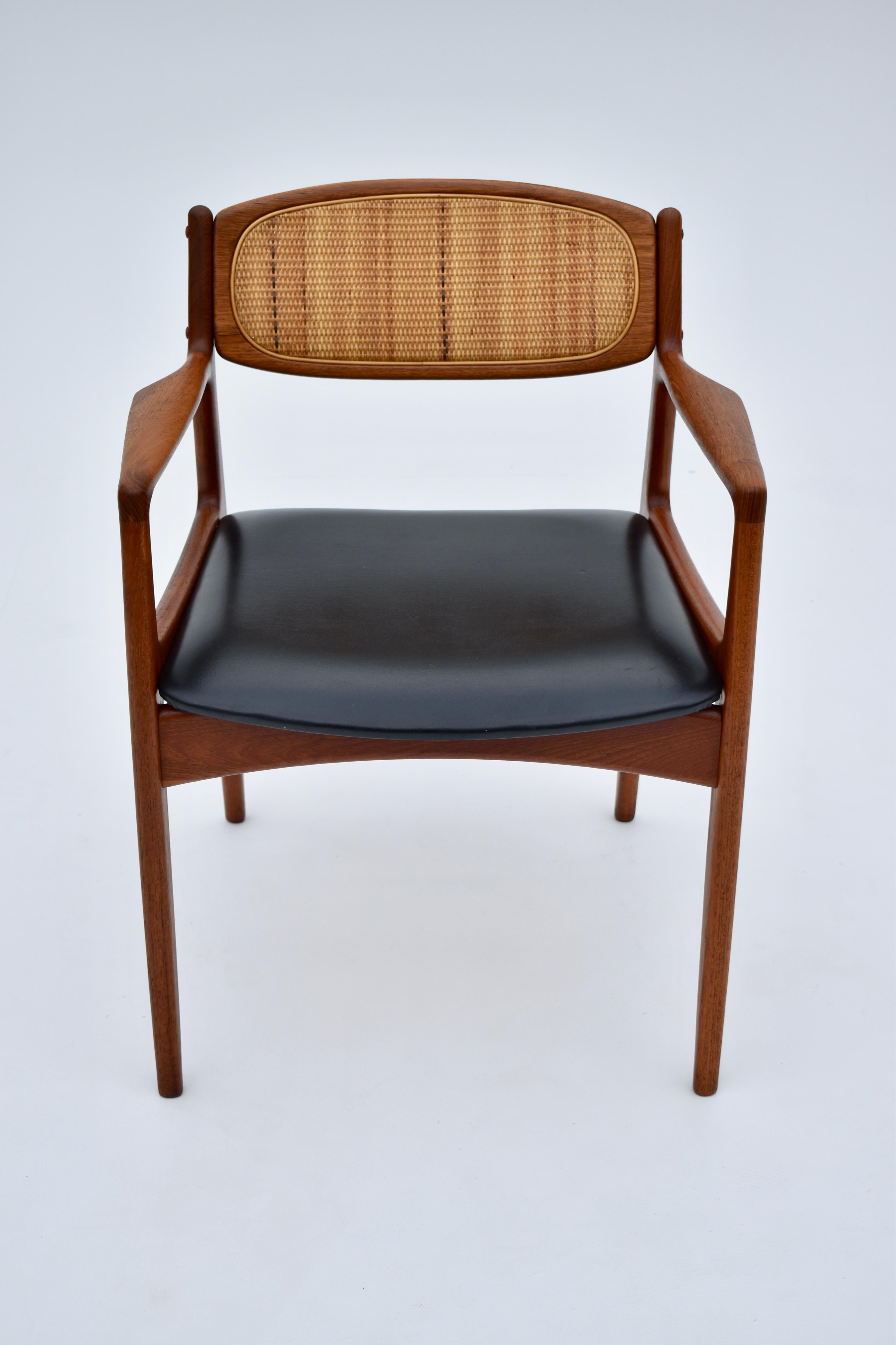 A particularly hard design to find this is a very handsome desk chair or side chair designed by Ib Kofod Larsen for Christian linneberg.

A solid teak frame with original rattan backrest and original black vinyl seat. A very pleasing mix of