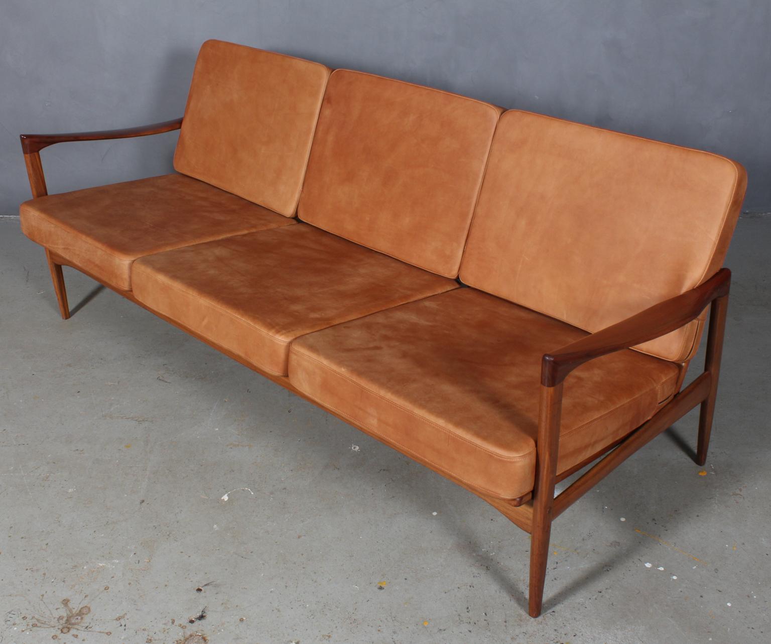Ib Kofod-Larsen three-seat sofa with frame of walnut.

New upholstered cushions in vintage tan aniline leather.

Model Kandidaten, made by Ope.
 