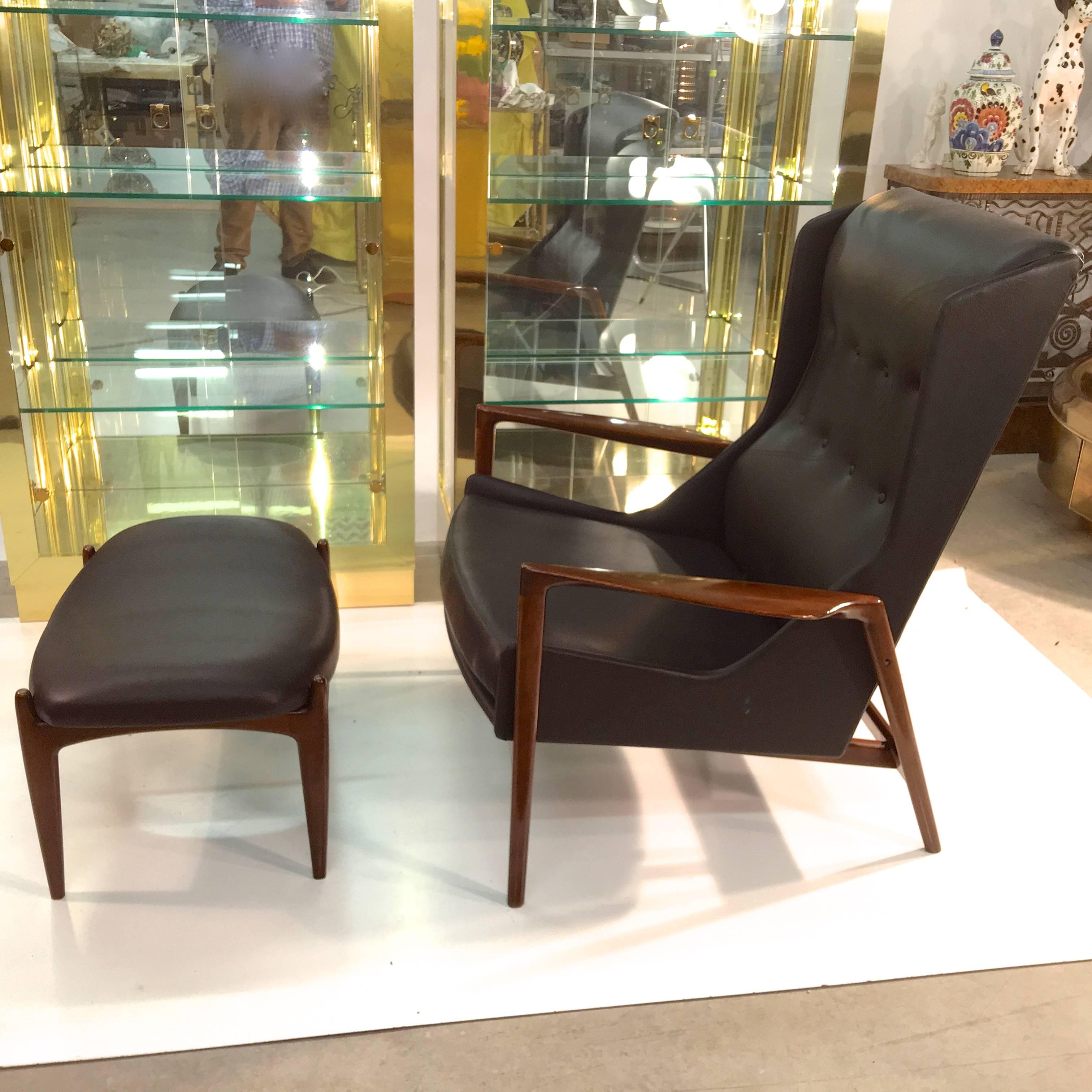 1960s Danish wing back walnut frame lounge chair and ottoman by Ib Kofod Larsen, imported by Selig. Newly reupholstered in black faux leather.

More photos to follow.