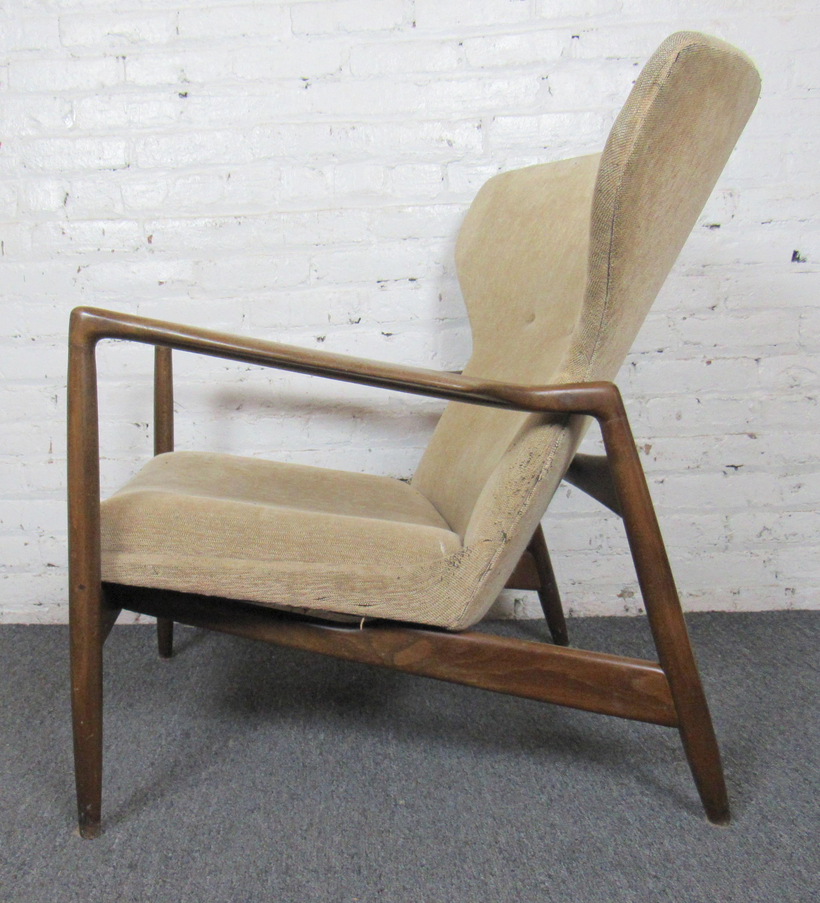 Mid-Century Modern wingback chair designed in Denmark by Kofod-Larsen for Selig. 

(Please confirm item location - NY or NJ - with dealer).
 