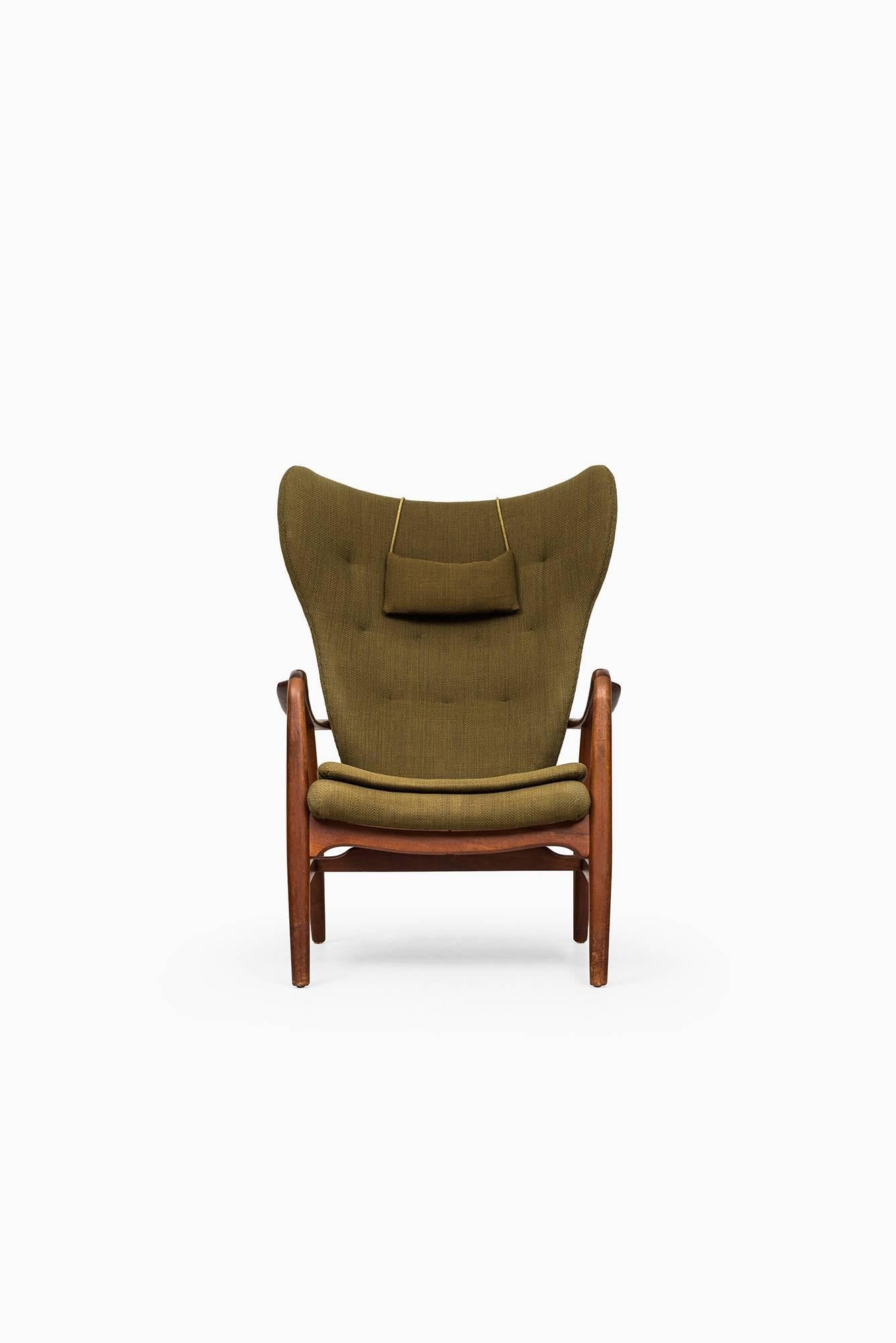 Rare wingbacked easy chair designed by Ib Madsen & Acton Schubell. Produced by Madsen & Schubell in Denmark.