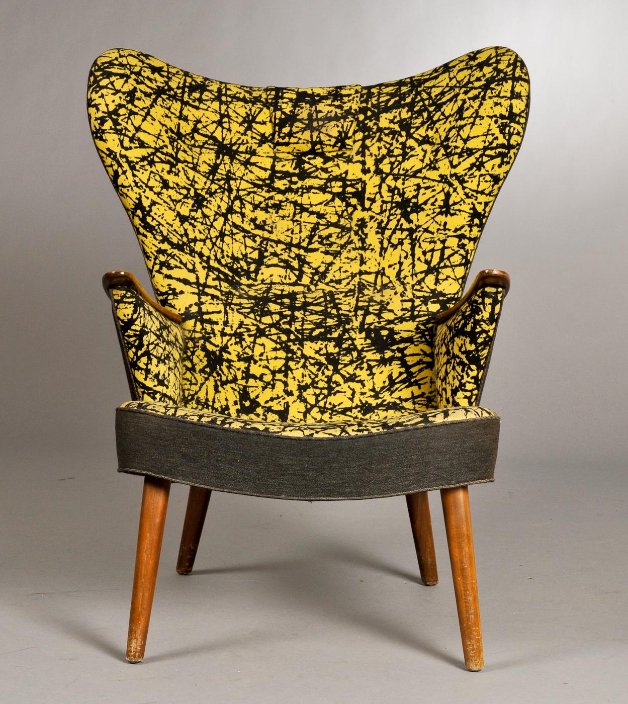Fabulous lounge with matching stool by Danish designers Ib Madsen & Acton Schubell from the 1950's in the original black and yellow patterned fabric. Stylish, elegant and comfortable.
