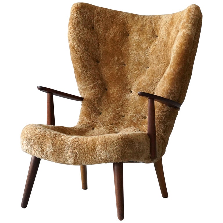 Ib Madsen & Acton Schubell sheepskin and teak lounge chair, 1950s, offered by Ponce Berga