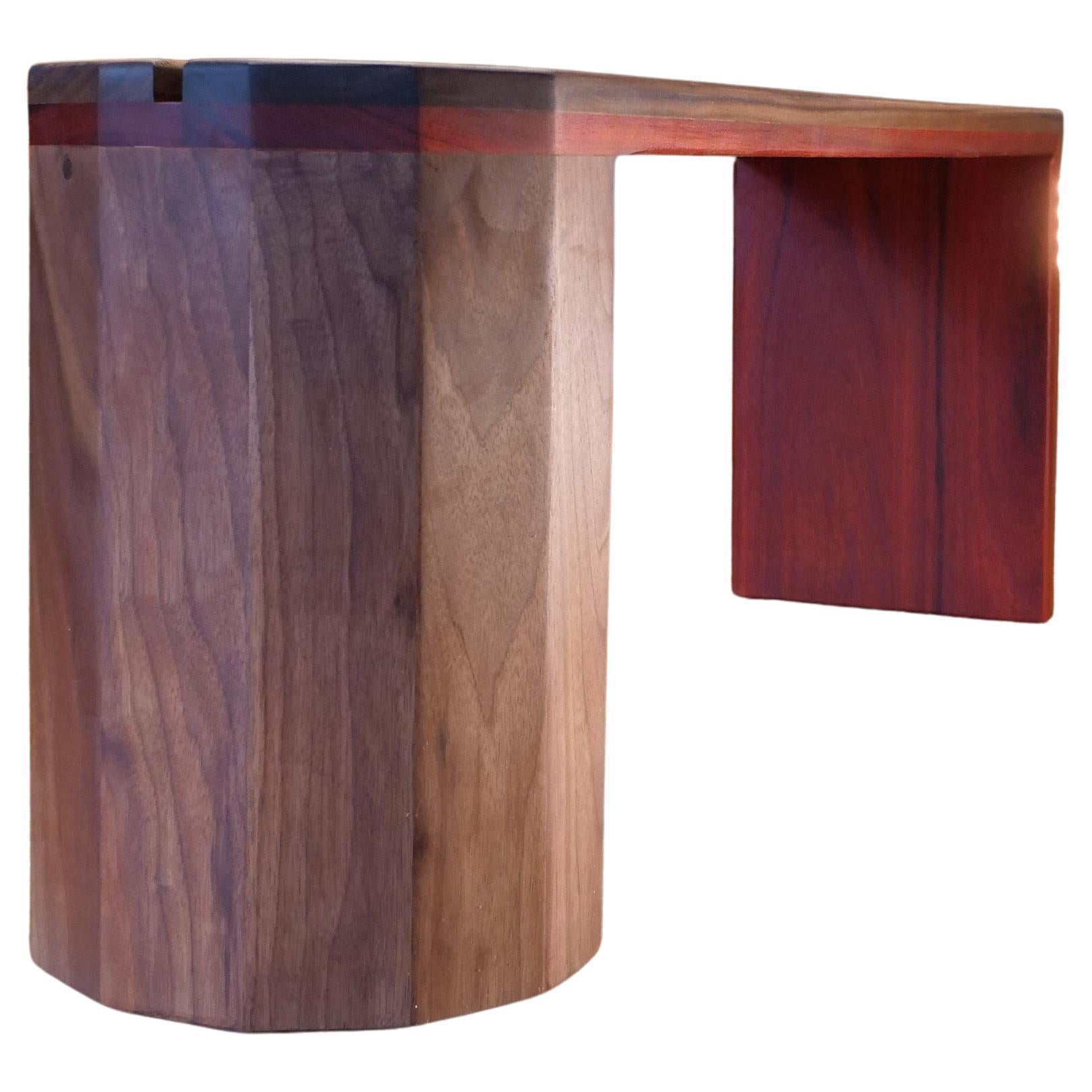 This exquisite walnut bench marries the opulence of natural wood with contemporary design. The body is crafted from rich walnut, known for its durability and deep, complex tones that deepen with time. A striking feature is the Padauk bottom, which
