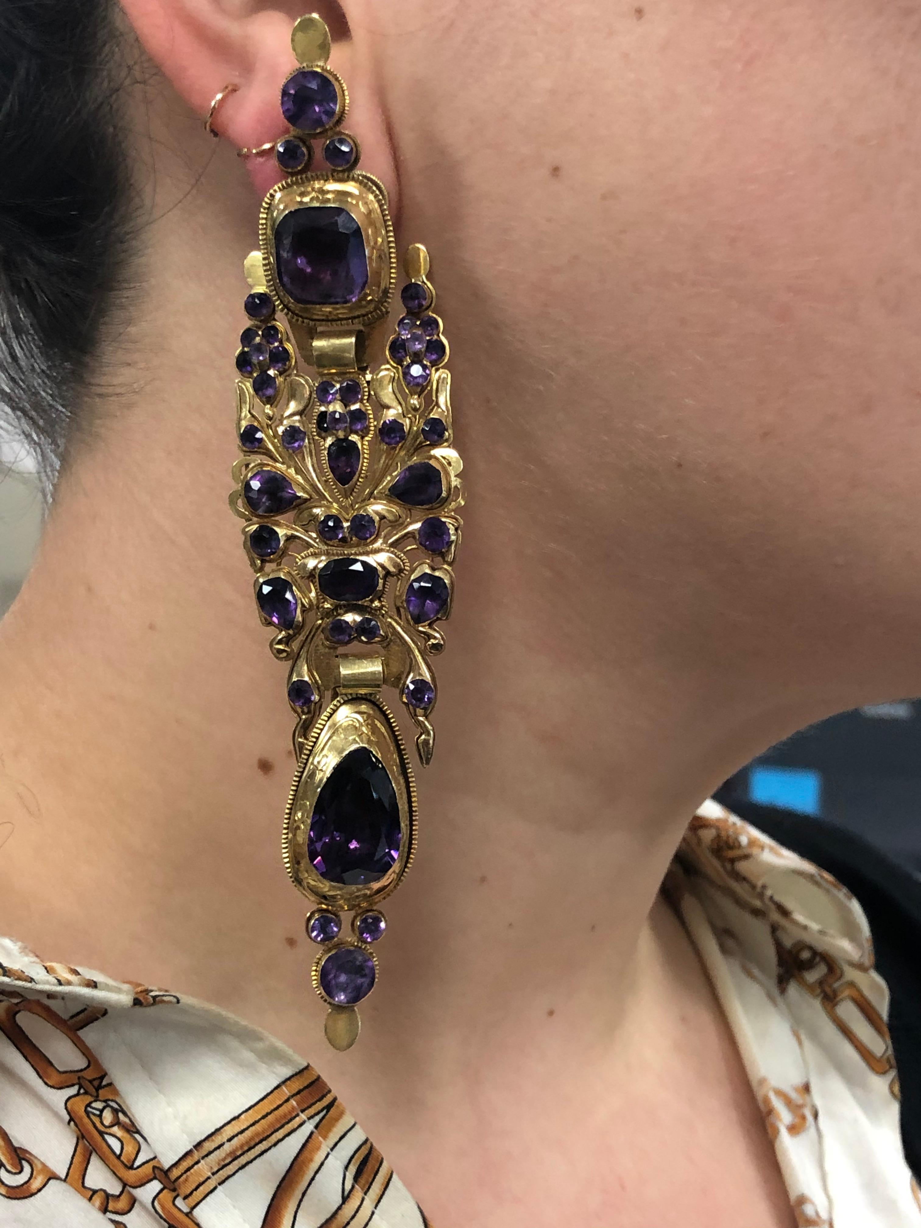 Iberian Amethyst Yellow Gold Long Pendant Earrings

Original yellow gold closed back mountings are set with rich amethysts in long Iberian earrings, circa 1850. The earrings measure 5 inches in length and 1-1/4 inch at the widest point.