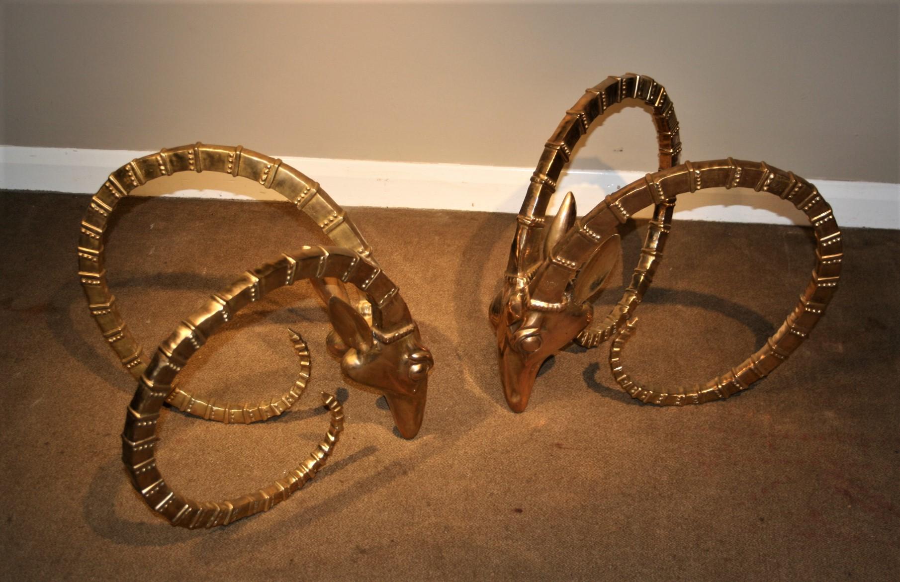 Sculptural cast brass base with glass top.