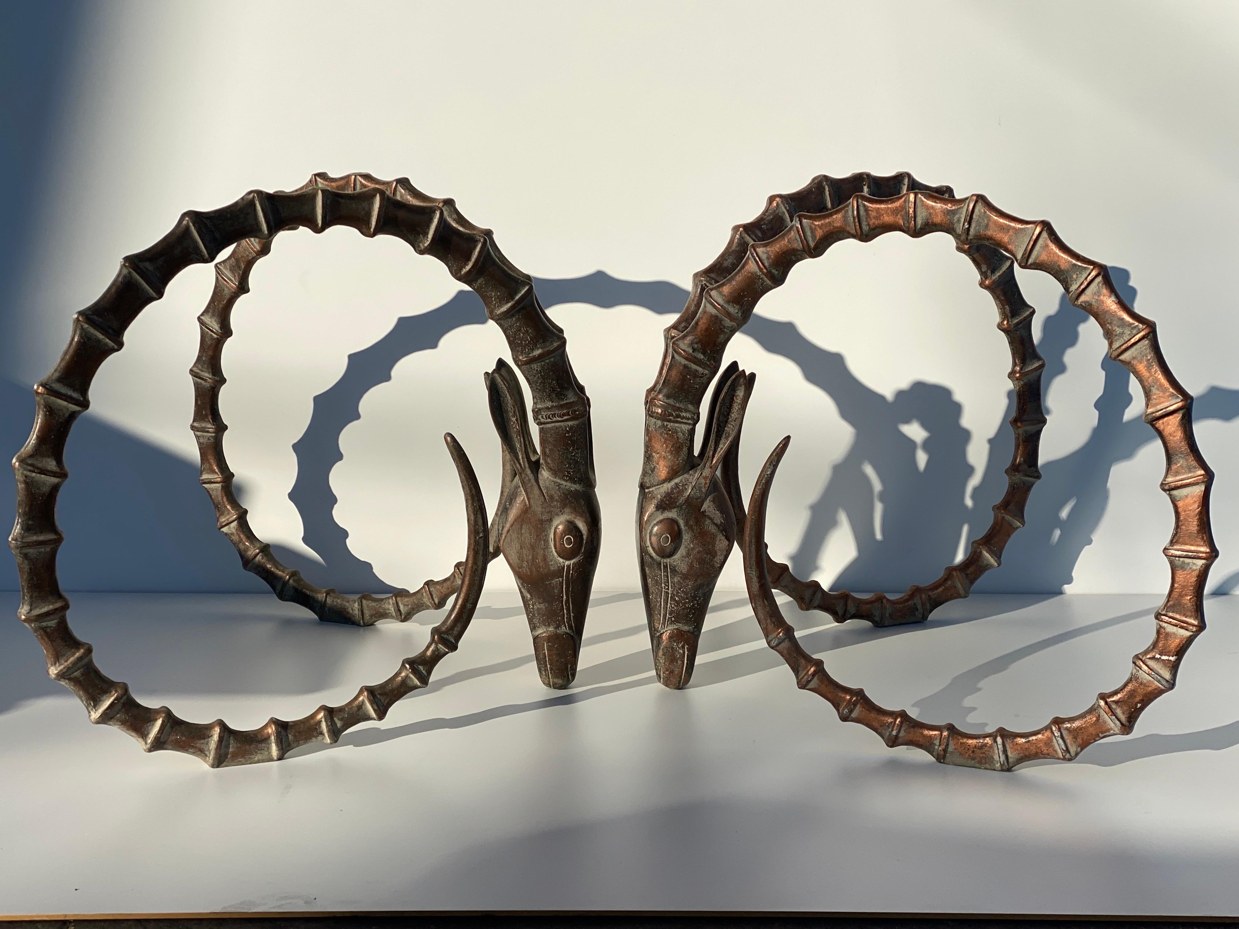 Ibex heads dining table base made of solid heavy metal in antique bronze / copper finish in the style of Alain Chervet. Each head measures 34