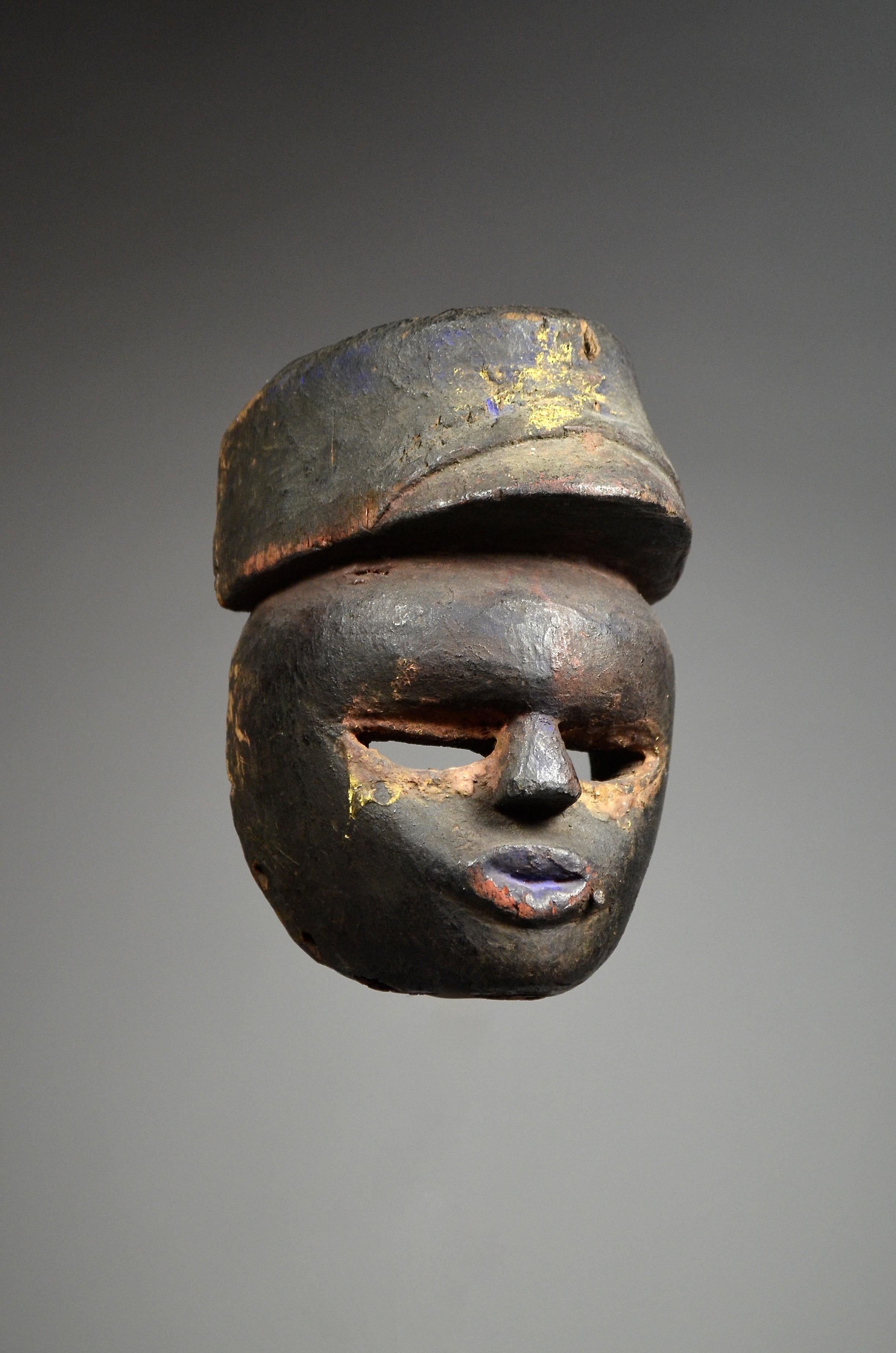 IBIBIO MASK 

Nigeria
Wood
Early 20th Century

Provenance:
- ex Helmut Zake (1918-1995) collection, Heidelberg, Germany
- Native auction, Brussels, Belgium

A rare well-used Ibibio mask from Nigeria wearing a hat. 
Traces of original