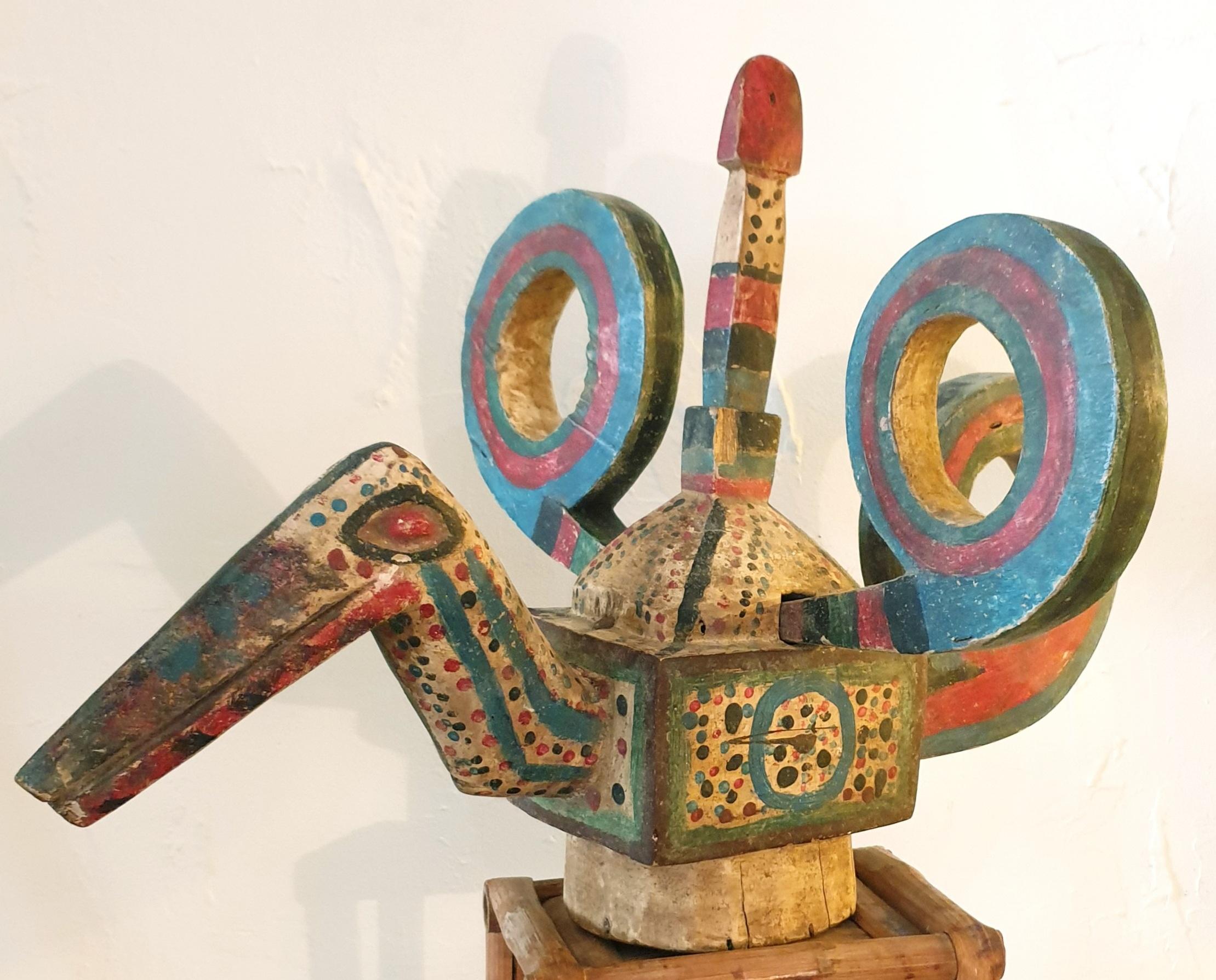 Mid-Century Ibibio wood carving of a Great Hornbill or (Kalao) from Nigeria. (The carving is shown in the first photo on a bamboo stand which is available if required.)

The Great Hornbill is a Nigerian mystical bird. If you catch sight of one it is
