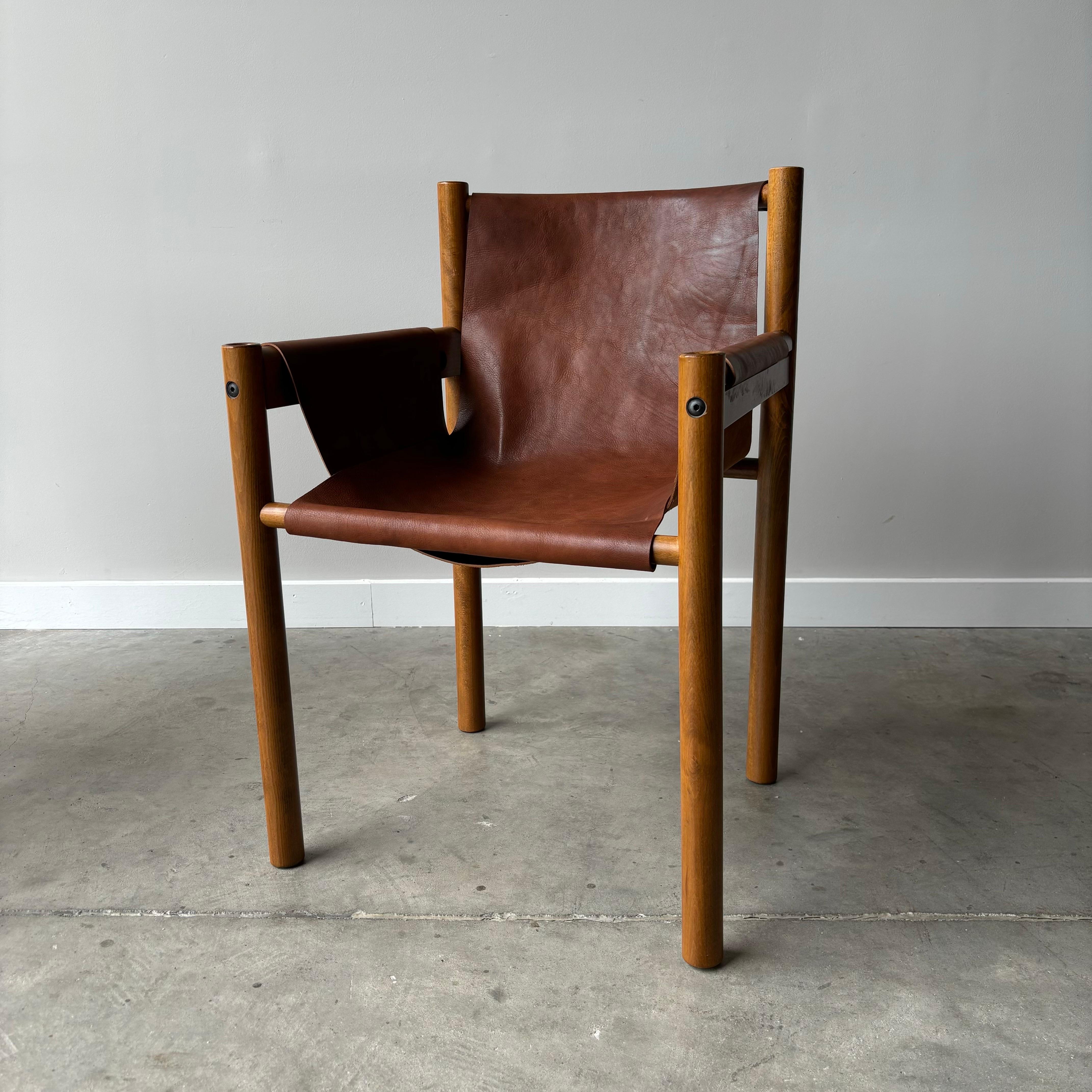 Wonderful vintage dining chairs by Ibisco dating to the 1970s.  Solid beech wood frames with new hide leather sling seats.  Minimalist and unique.