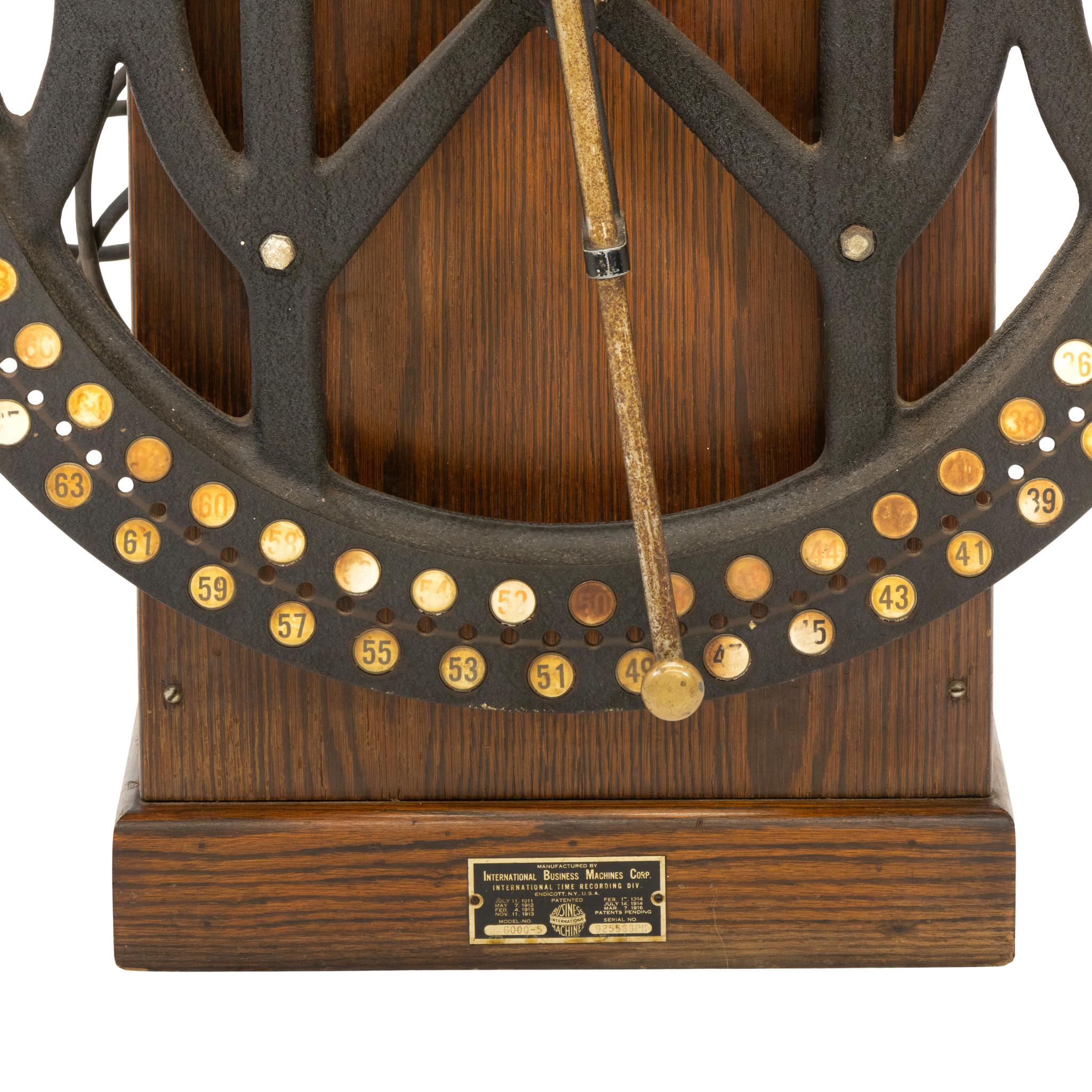 Antique oak case IBM Time Clock with original metal manufacturer's tag on front measurers 35