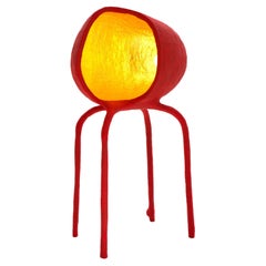 IC-12 Standing Lamp, a four legged conversation starter in bright red