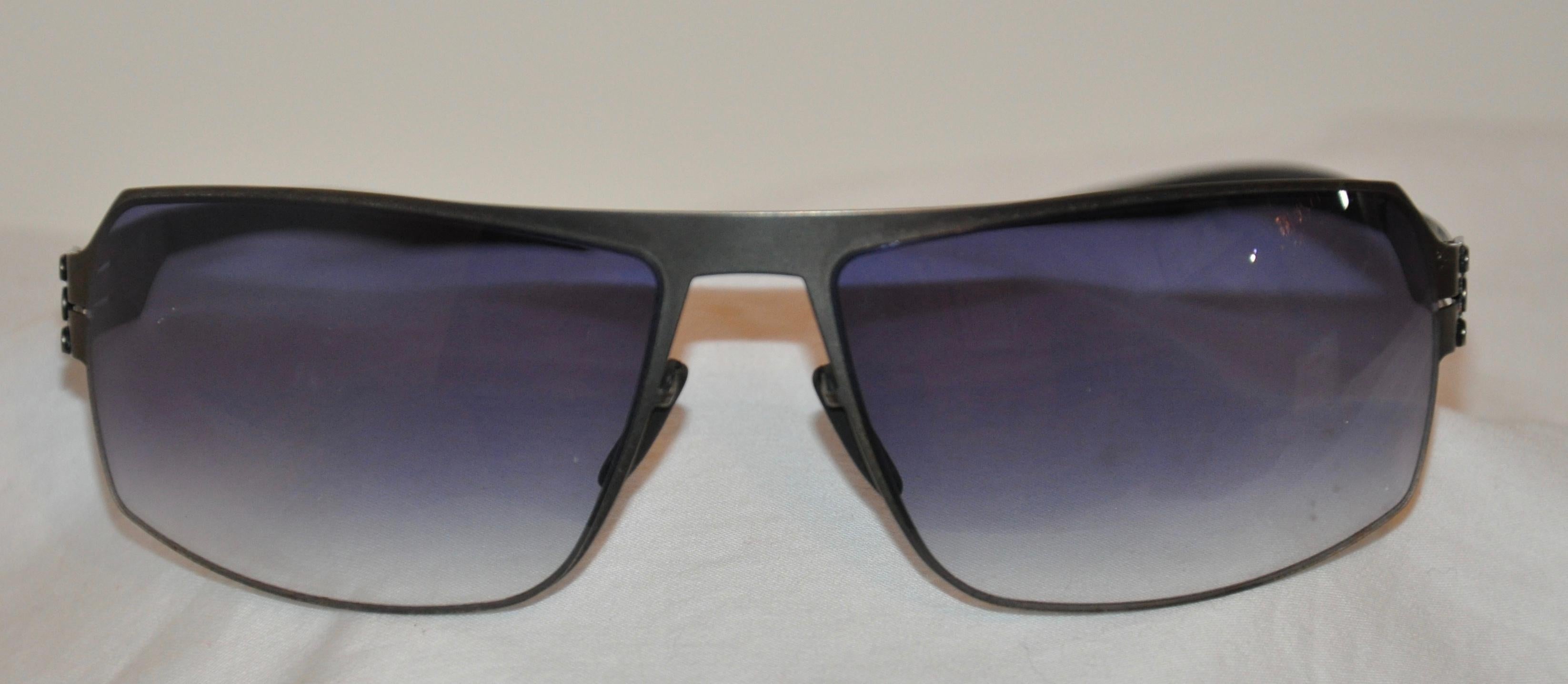    Ic! Berlin Black curved-styled flexible titanium blue-hue sunglasses, made in Germany, measures 5 1/2 inches across the front. Measuring the curve aspect from right-to-left measures 6 1/2 inches, height is 1 5/8 inches, and the arms are 5 1/2