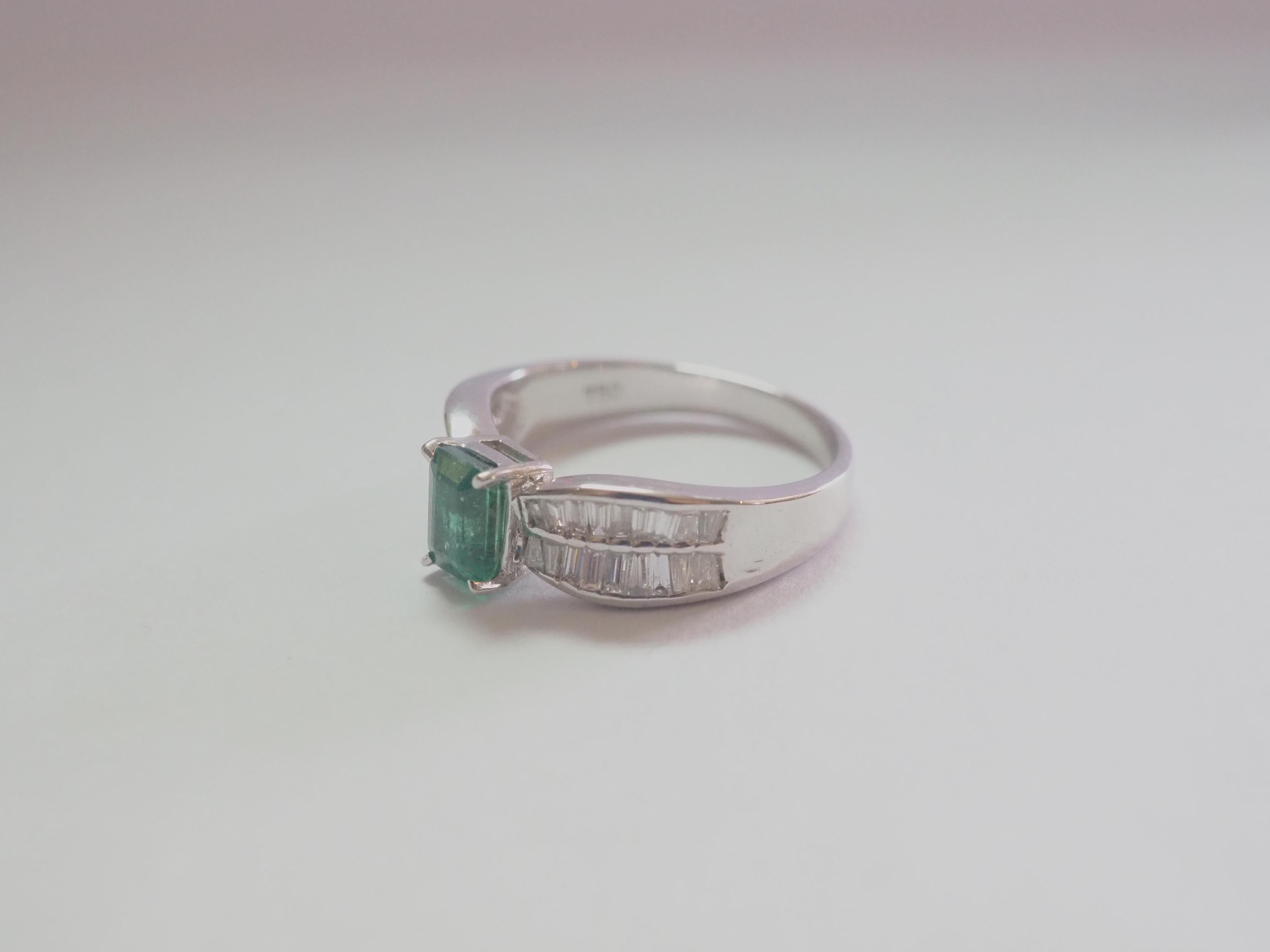 This engagement piece is a beautiful 18K white gold fine emerald and diamond ring! The piece is accompanied by ICA report card #150970 PIN: E374 on the wonderful vibrant emerald stating that this beautiful stone has insignificant level of clarity