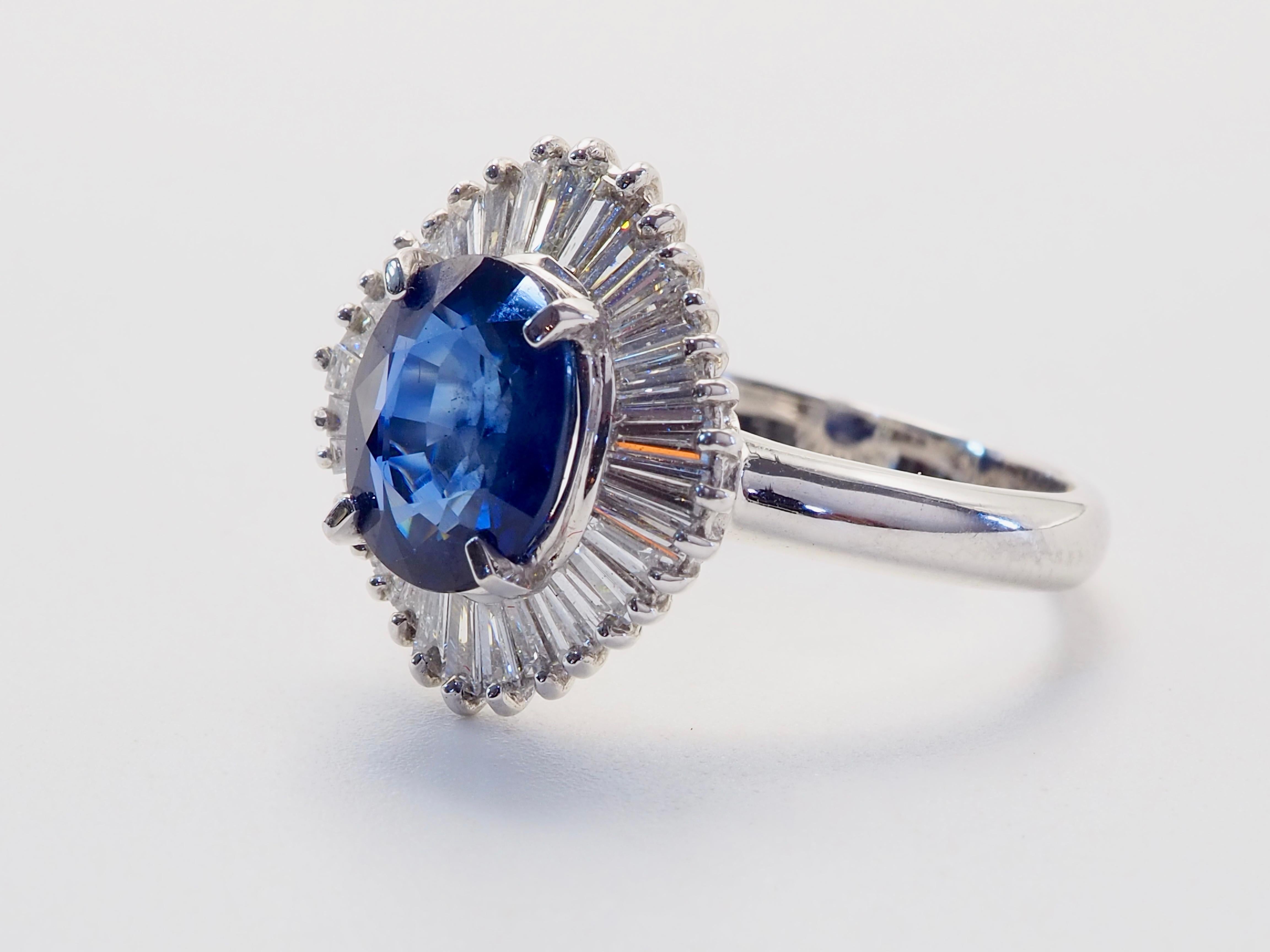  This amazing vintage ballerina statement ring boasts an oval blue sapphire of 2.25 carats accompanied by ICA certificate. The stunning oval cut sapphire is heavily surrounded by high grade natural tapered baguette cut diamonds. Immaculate