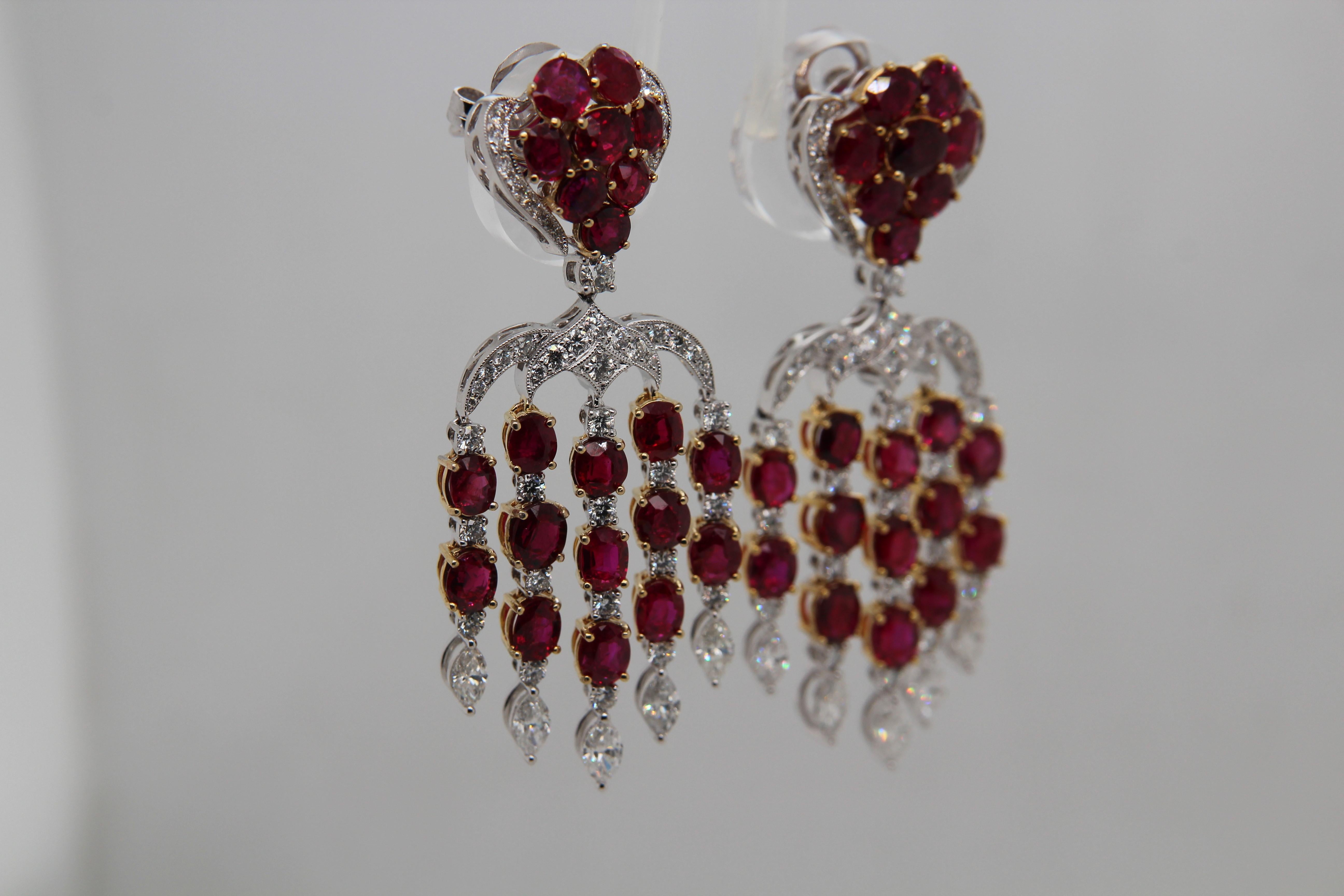ICA certified 15.28 carat Burmese unheated rubies and diamond earrings in 18 karat gold. The forty two rubies weigh 15.28 carat certified by International Colored Gemstone Association (ICA) unheated and 'Pinkish red to Vivid red'. The diamond weigh