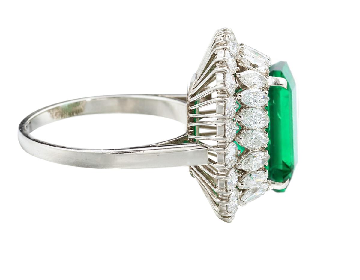 Magnificent platinum ring with a stunning clear natural emerald (no oil) of 1.96 carats surrounded by 1 carat round brilliant cut diamonds. 

Wear this exquisite and delicate ring as luxurious extra during daytime and/or to complement your evening