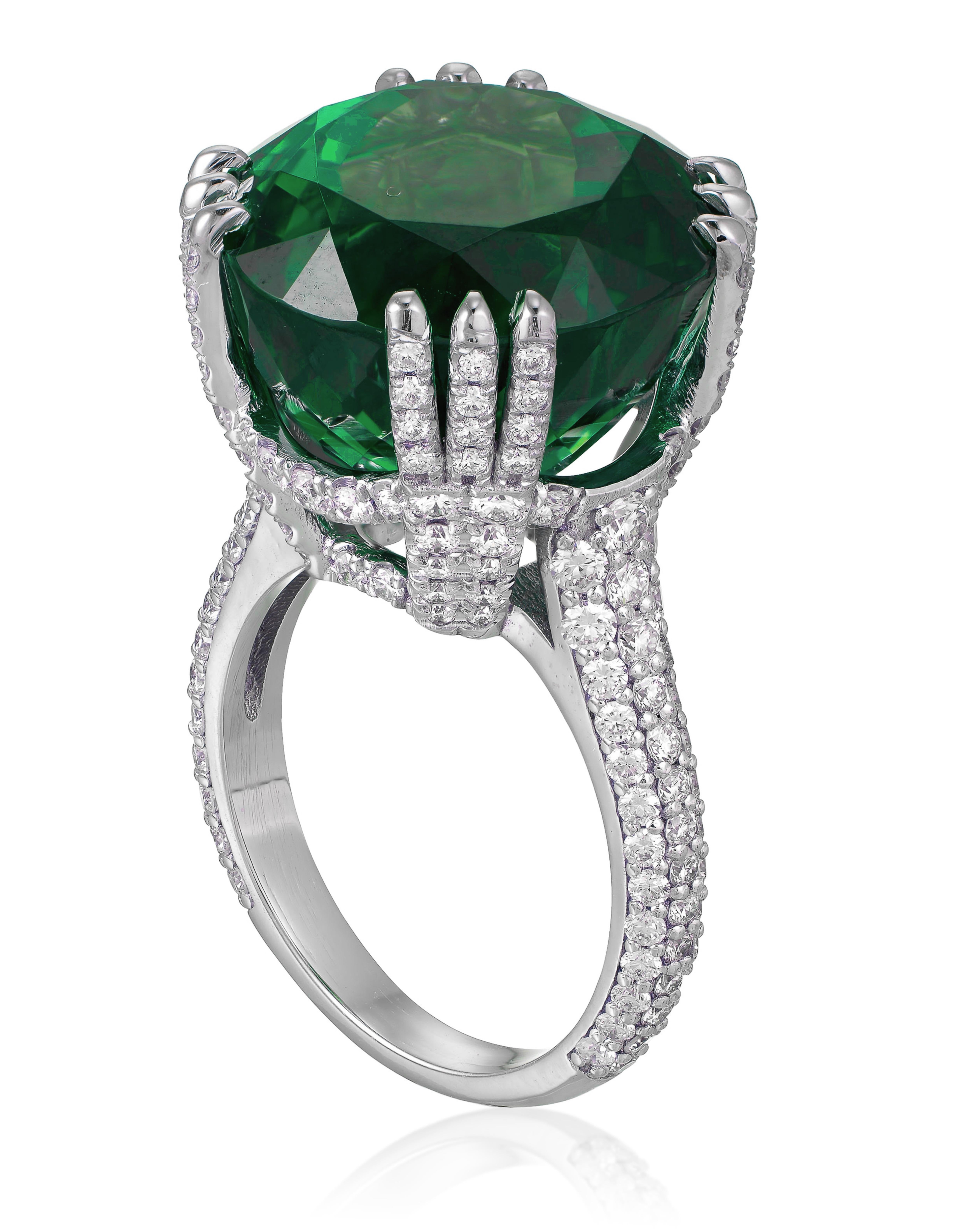 A stunning green emerald, weighing an impressive 9.61 ct. This exceptional emerald features fire that captures the eye. Set in a luxurious round pave diamond band

This exquisite piece is perfect for those looking to make a statement with a unique