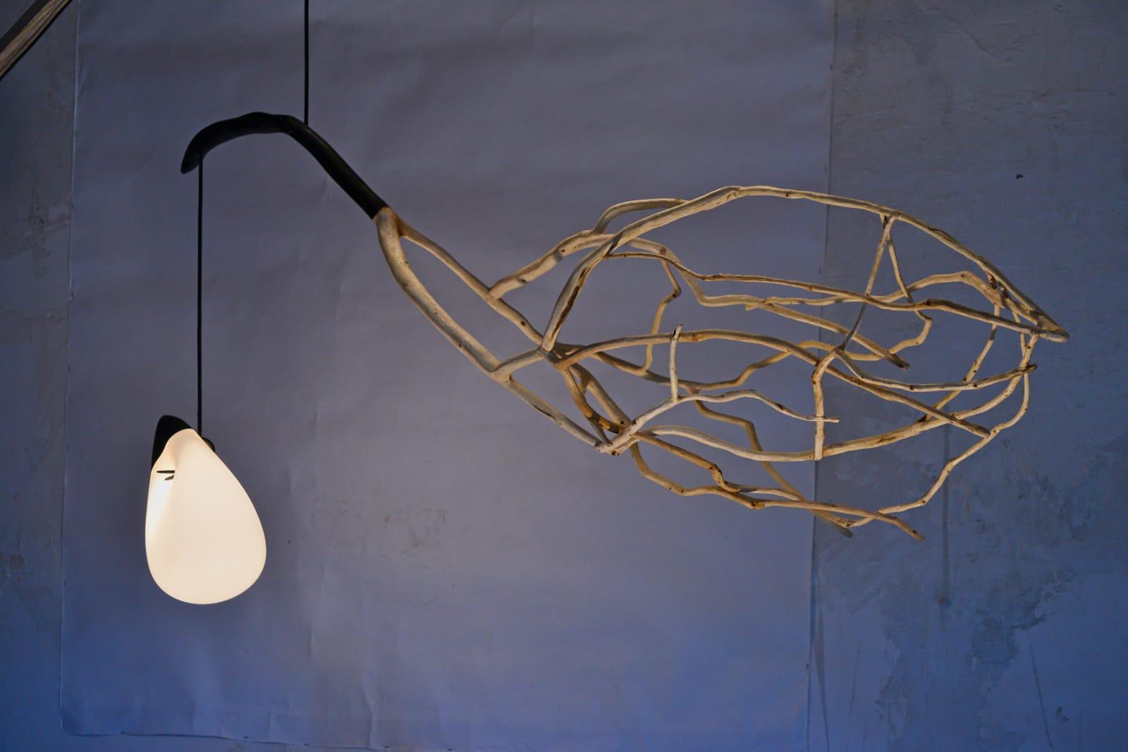 Icarus Sculpted Lighting by Jerome Pereira 
Materials: Oak Tree, blown glass
Dimensions: L 180 x L 60 x H 40 cm
The width of the wing is 40cm.
The position of the glass globe is adjustable
Bulbs: E12 socket. Dimmable with dimmable bulbs.