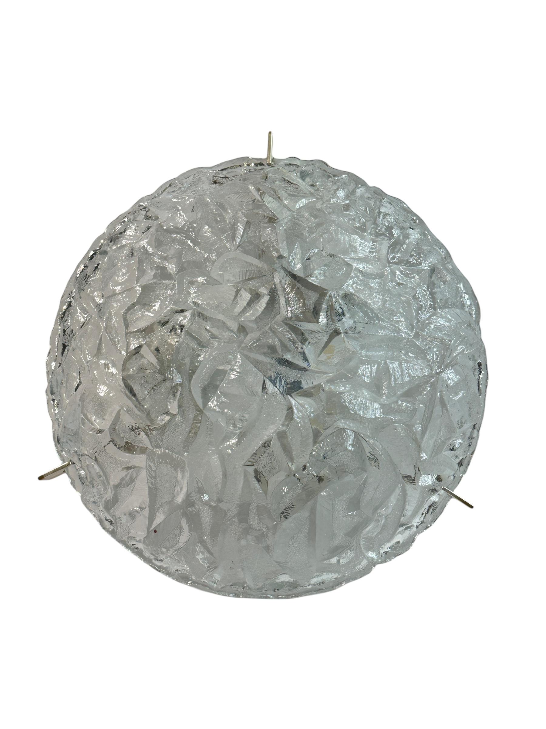 A beautiful ice glass flush mount. Made in Italy in the 1970s. Gorgeous textured glass flush mount with metal fixture. The Fixture requires three European E14 / 110 Volt Candelabra bulbs, each bulb up to 60 watts. A nice addition to any room. Found